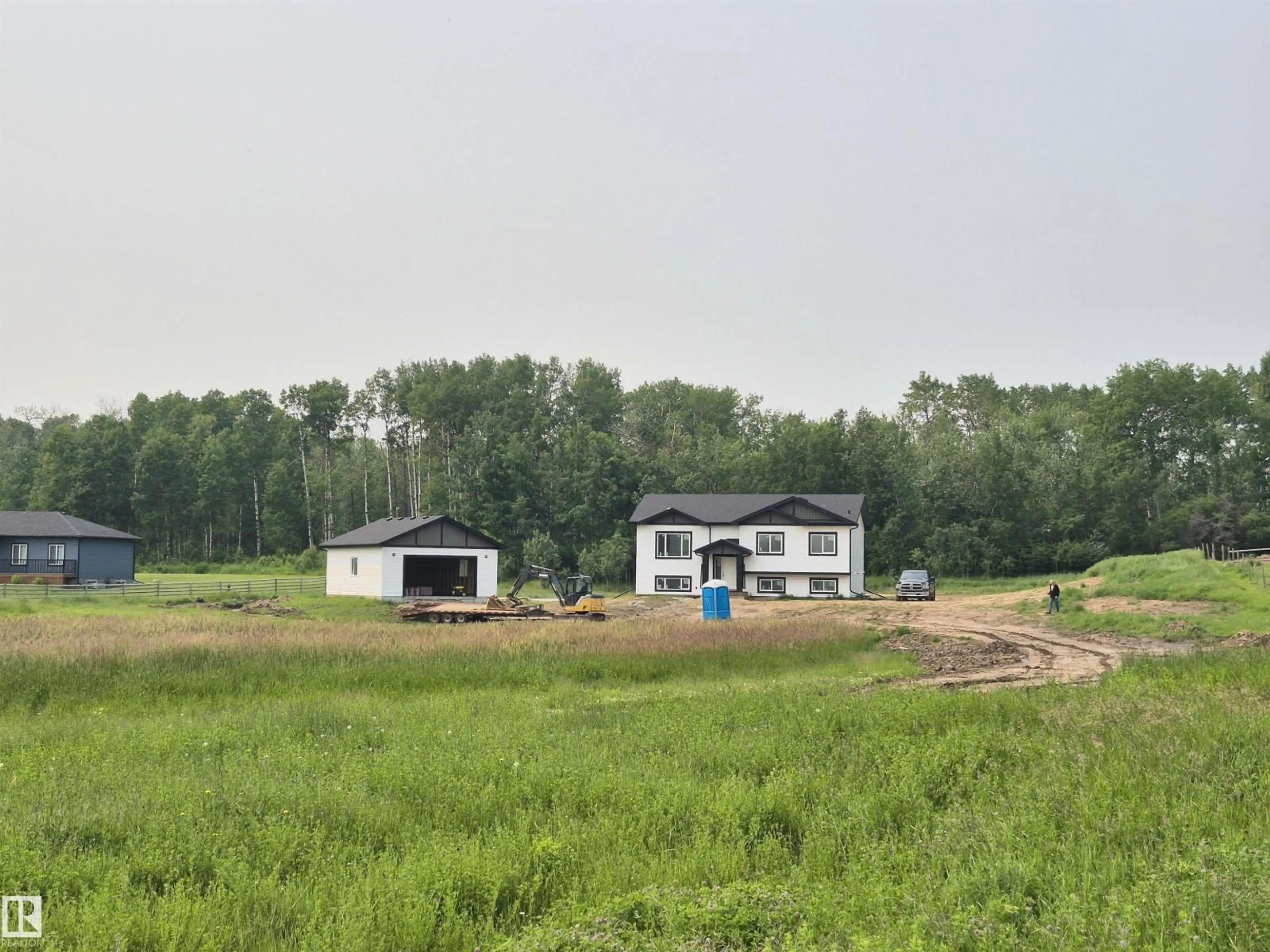 A pic from outside/outdoor area/front of a property/back of a property/a pic from drone, building for #401 - 55108 RANGE ROAD 15, Rural Lac Ste. Anne County Alberta T0E1V0