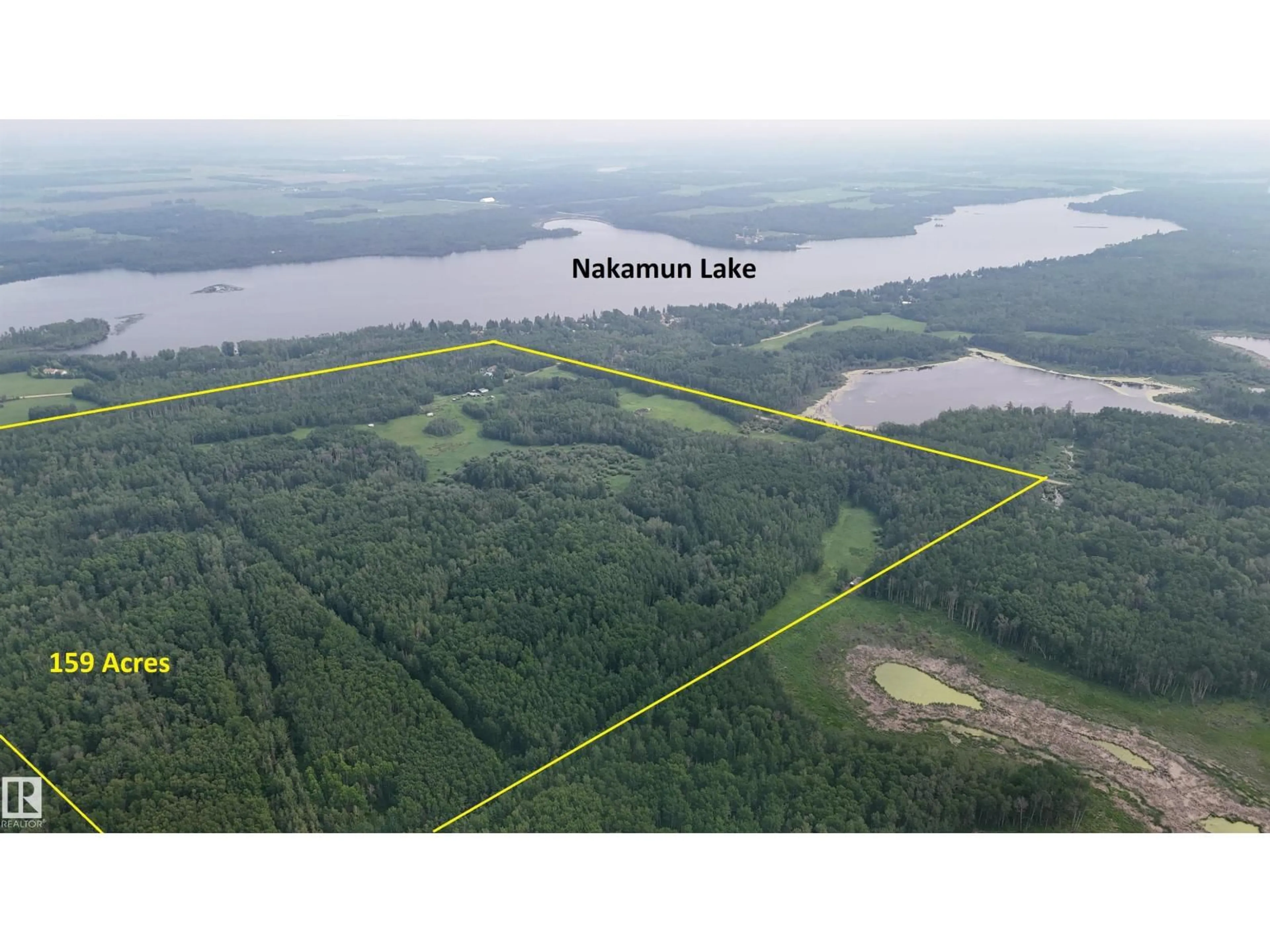 A pic from outside/outdoor area/front of a property/back of a property/a pic from drone, water/lake/river/ocean view for 56512 RGE ROAD 23, Rural Lac Ste. Anne County Alberta T0E1V0