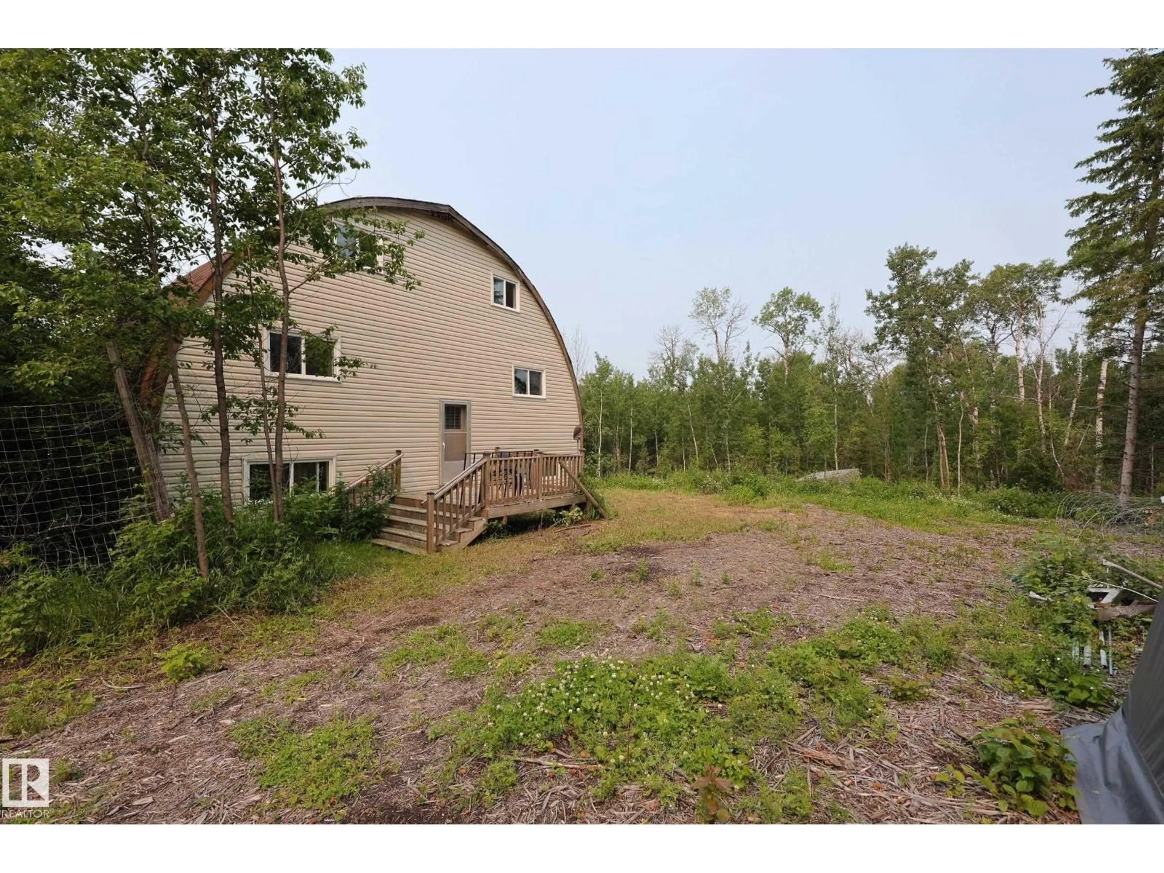 A pic from outside/outdoor area/front of a property/back of a property/a pic from drone, forest/trees view for 56512 RGE ROAD 23, Rural Lac Ste. Anne County Alberta T0E1V0