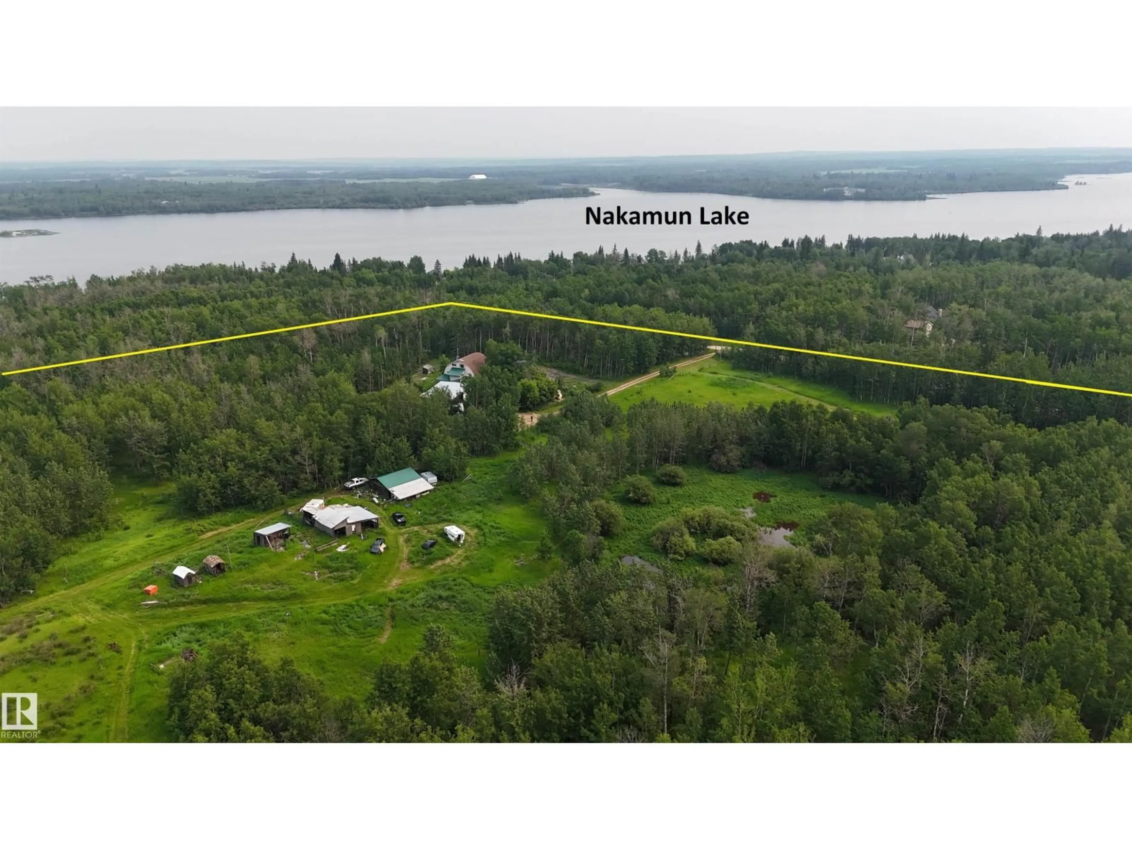 A pic from outside/outdoor area/front of a property/back of a property/a pic from drone, water/lake/river/ocean view for 56512 RGE ROAD 23, Rural Lac Ste. Anne County Alberta T0E1V0