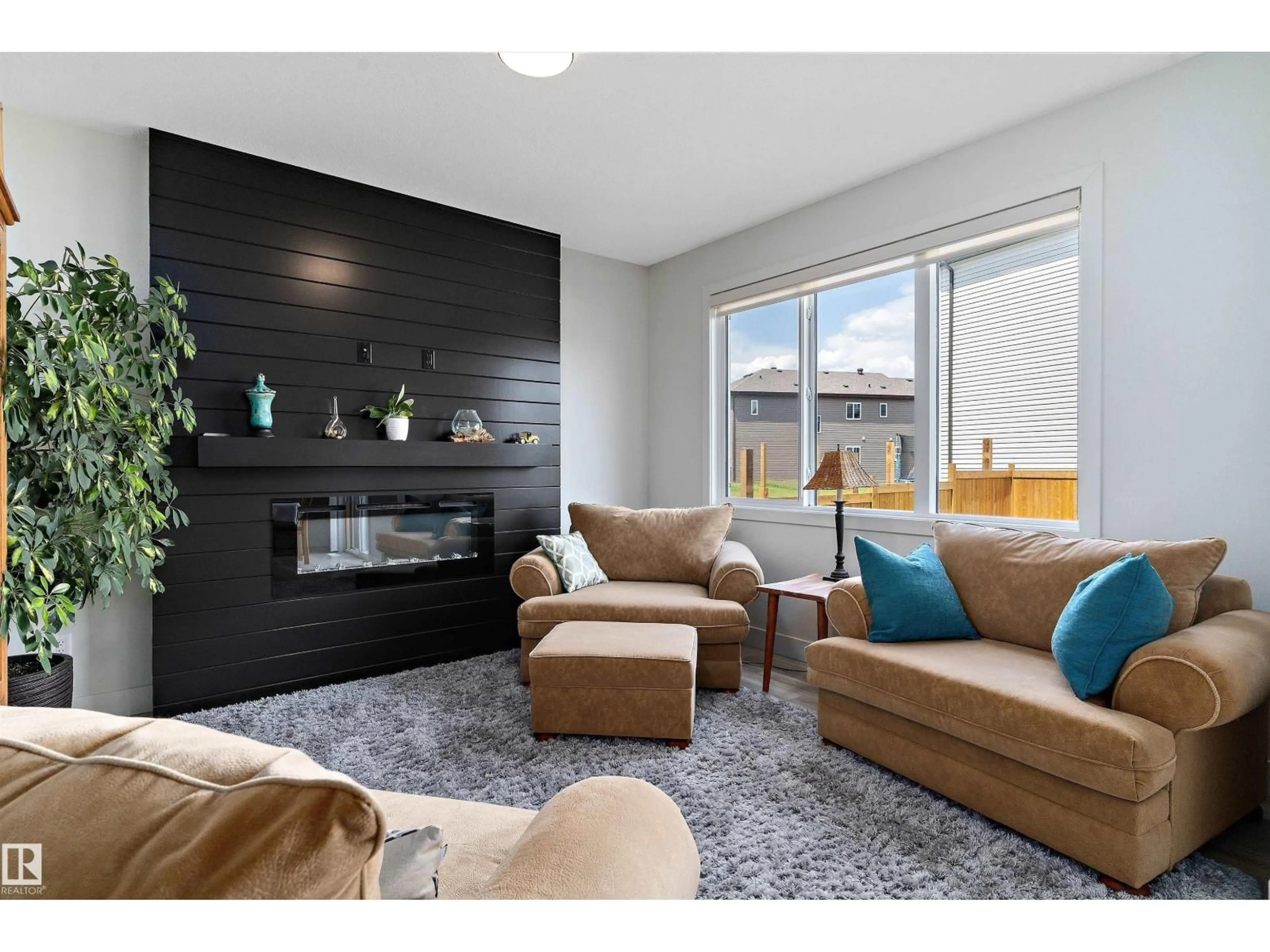 Living room with furniture, wood/laminate floor for 3804 42 AV, Beaumont Alberta T4X2Z6