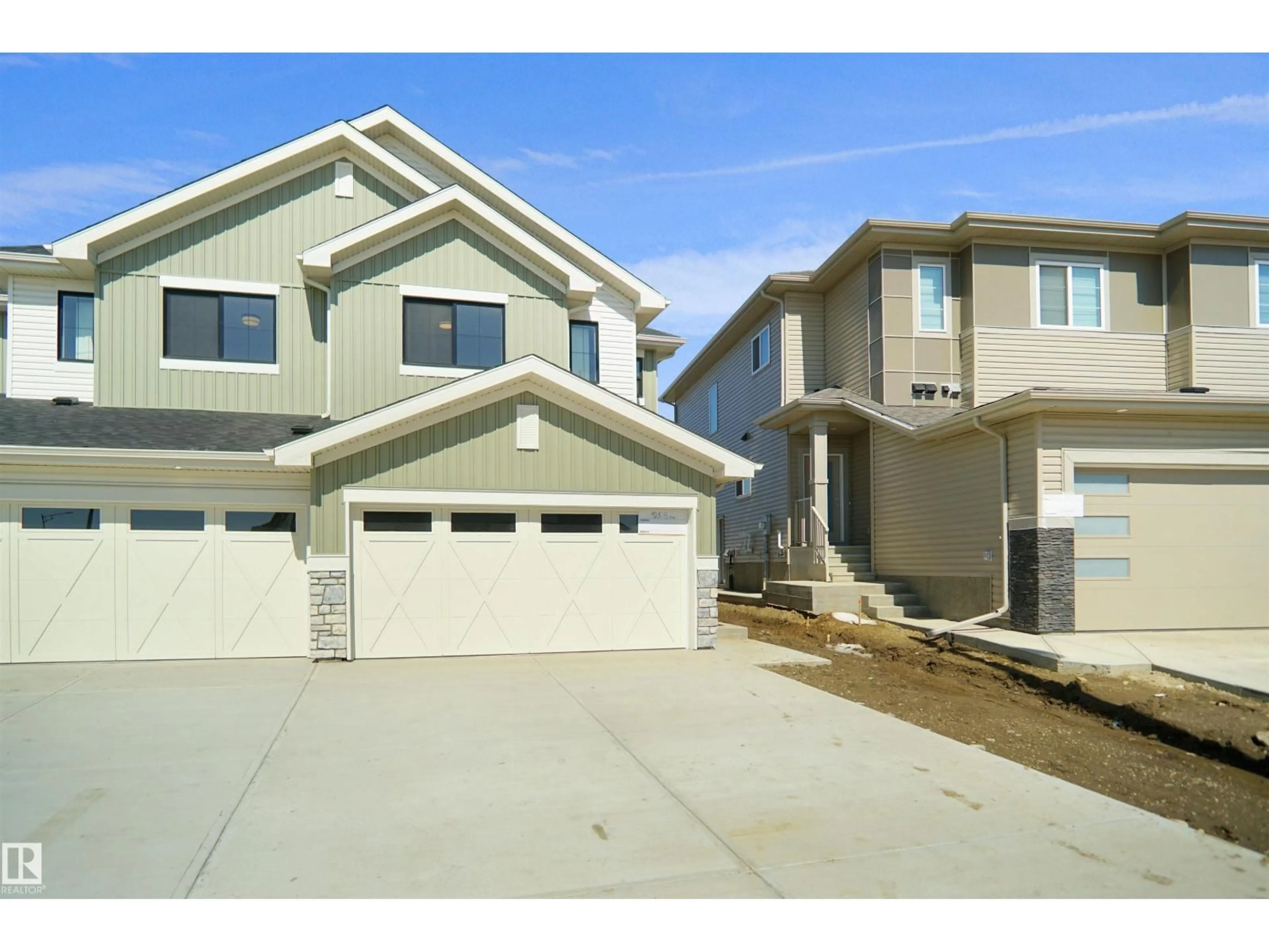 Home with vinyl exterior material, street for NW - 1820 188 ST, Edmonton Alberta T6M3N7