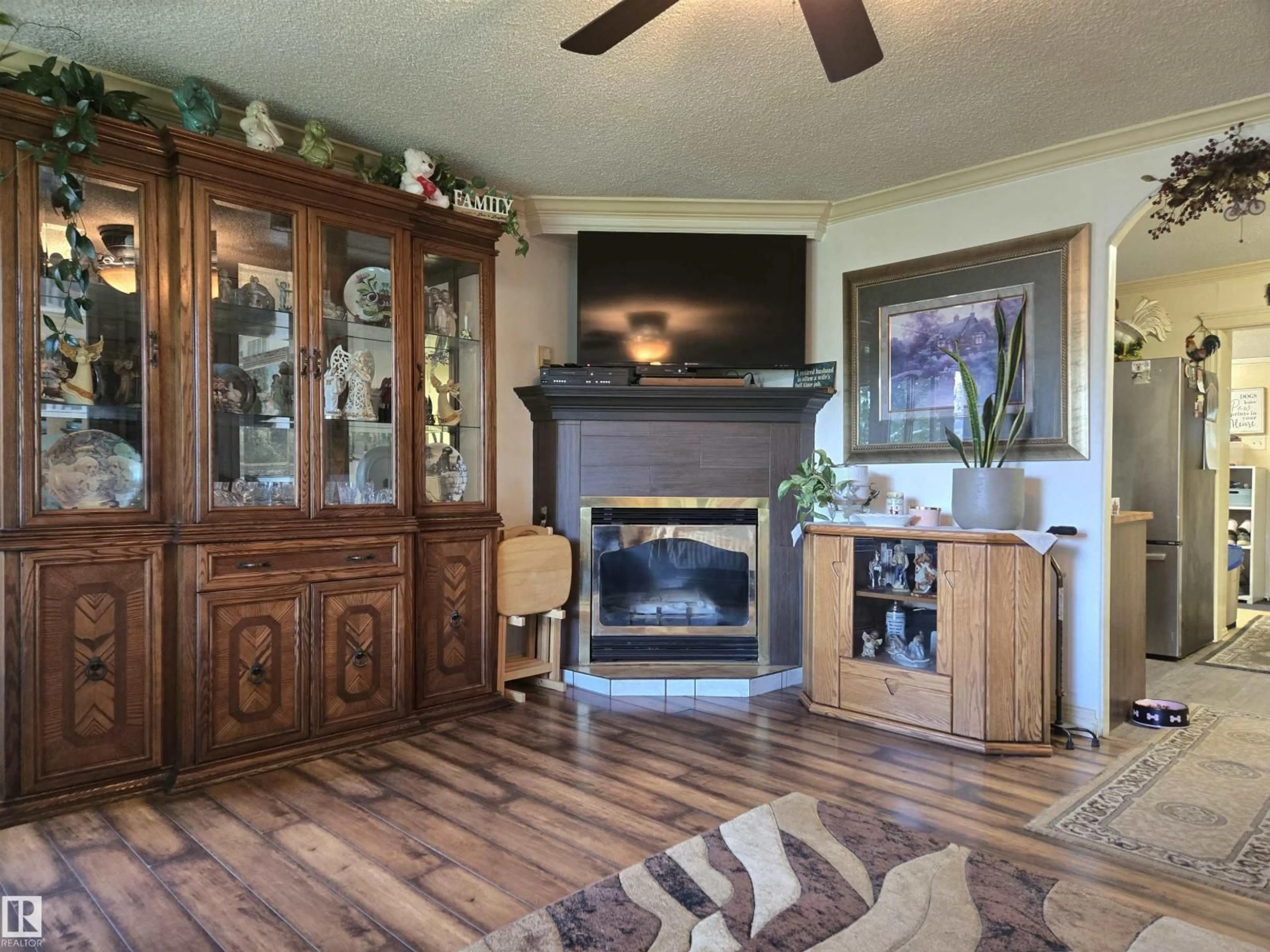Living room with furniture, wood/laminate floor for 5211 47 AV, Rural Lac Ste. Anne County Alberta T0E0A0