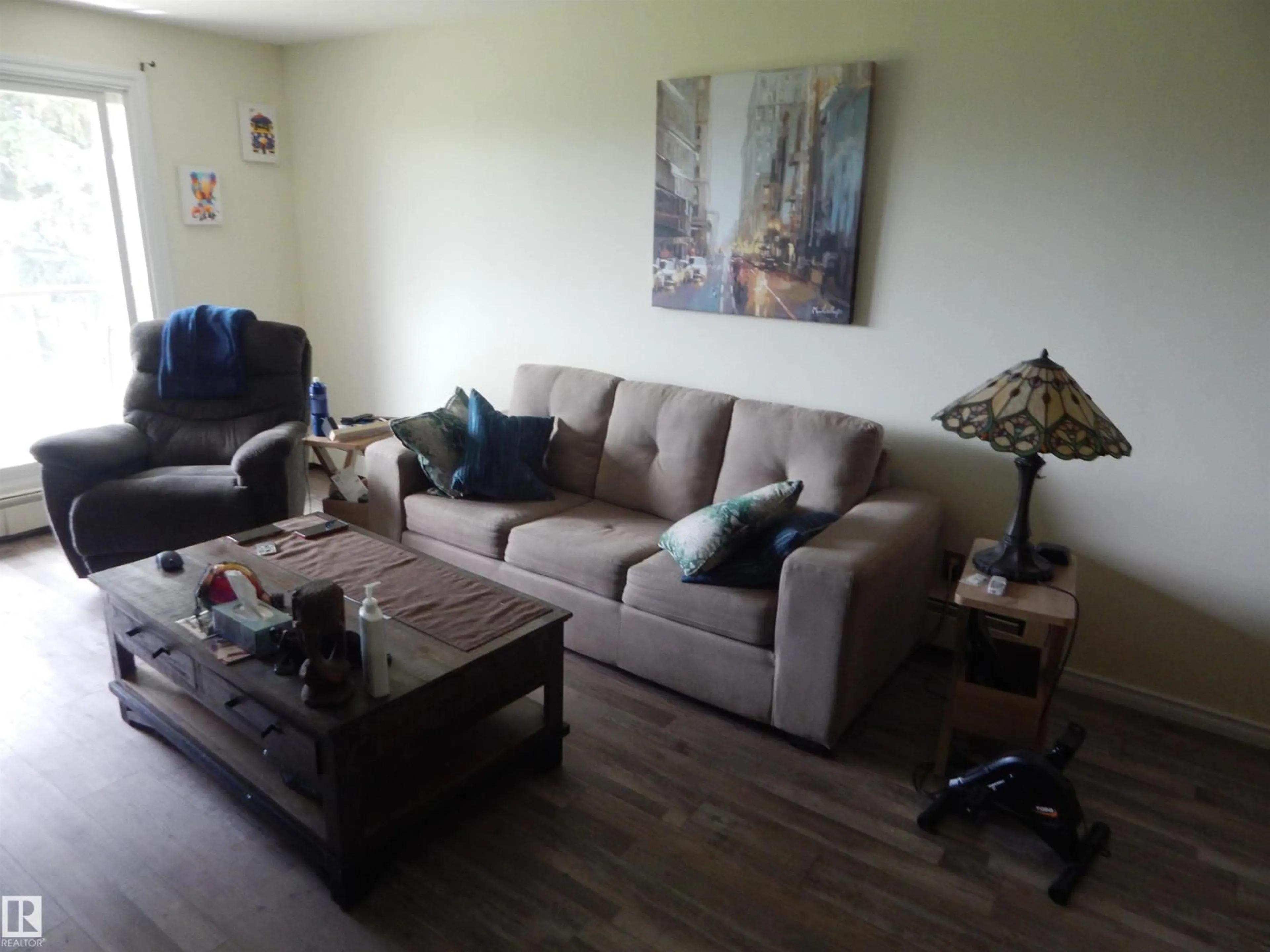 Living room with furniture, wood/laminate floor for #204 - 4601 131 AV, Edmonton Alberta T5A3G7