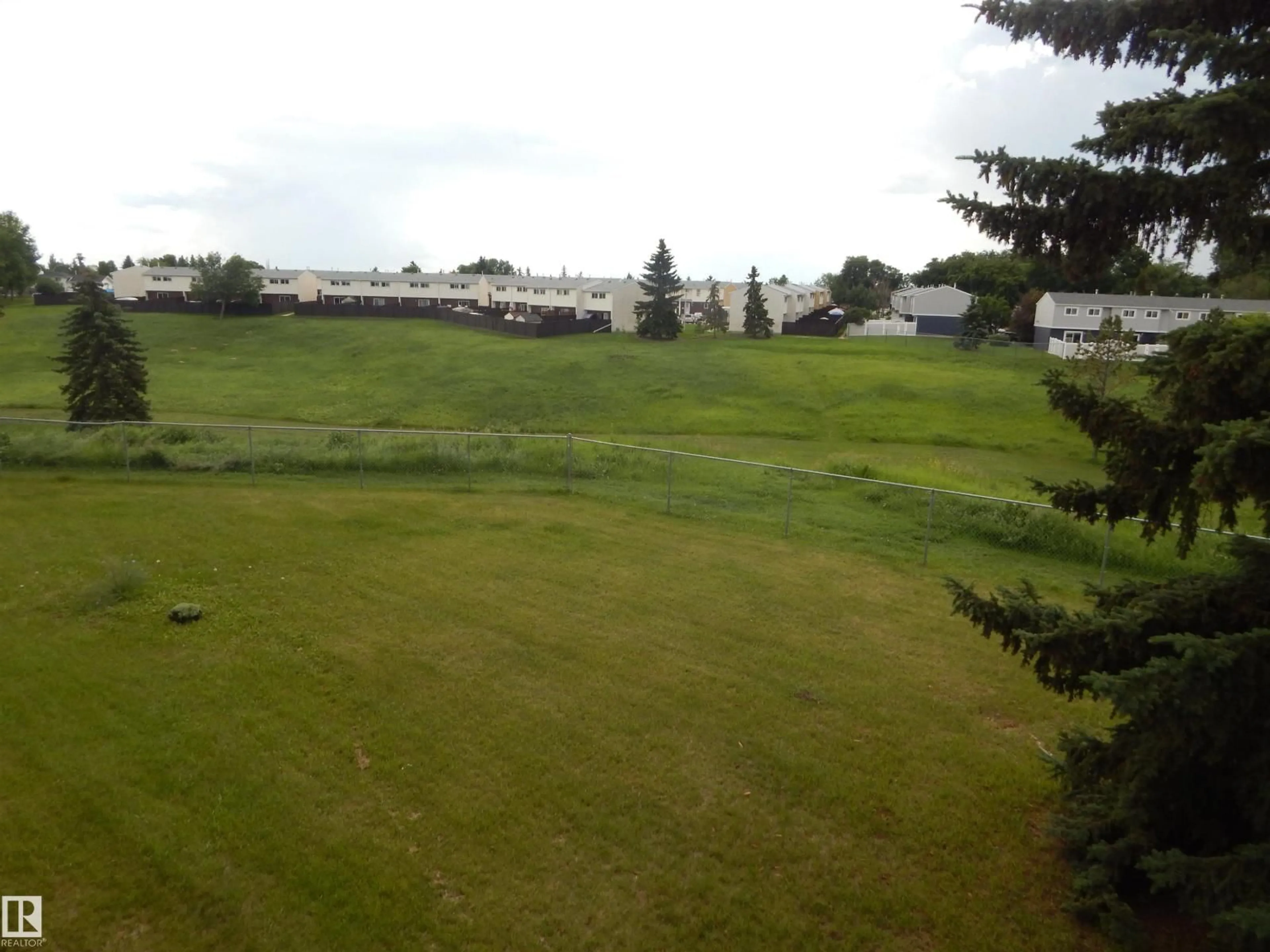 A pic from outside/outdoor area/front of a property/back of a property/a pic from drone, mountain view for #204 - 4601 131 AV, Edmonton Alberta T5A3G7
