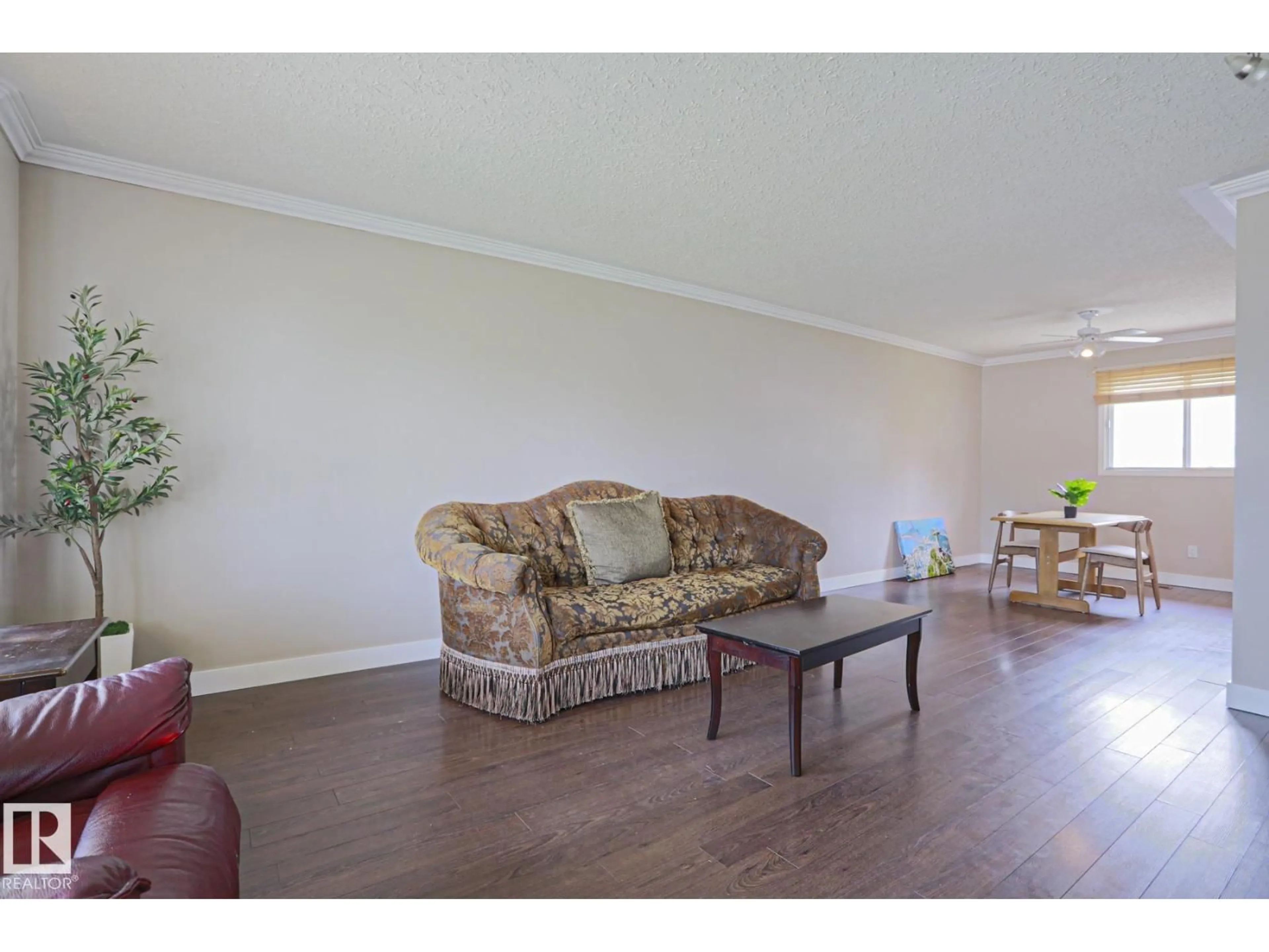 Living room with furniture, wood/laminate floor for 57 GARLAND CR, Sherwood Park Alberta T8A2P7