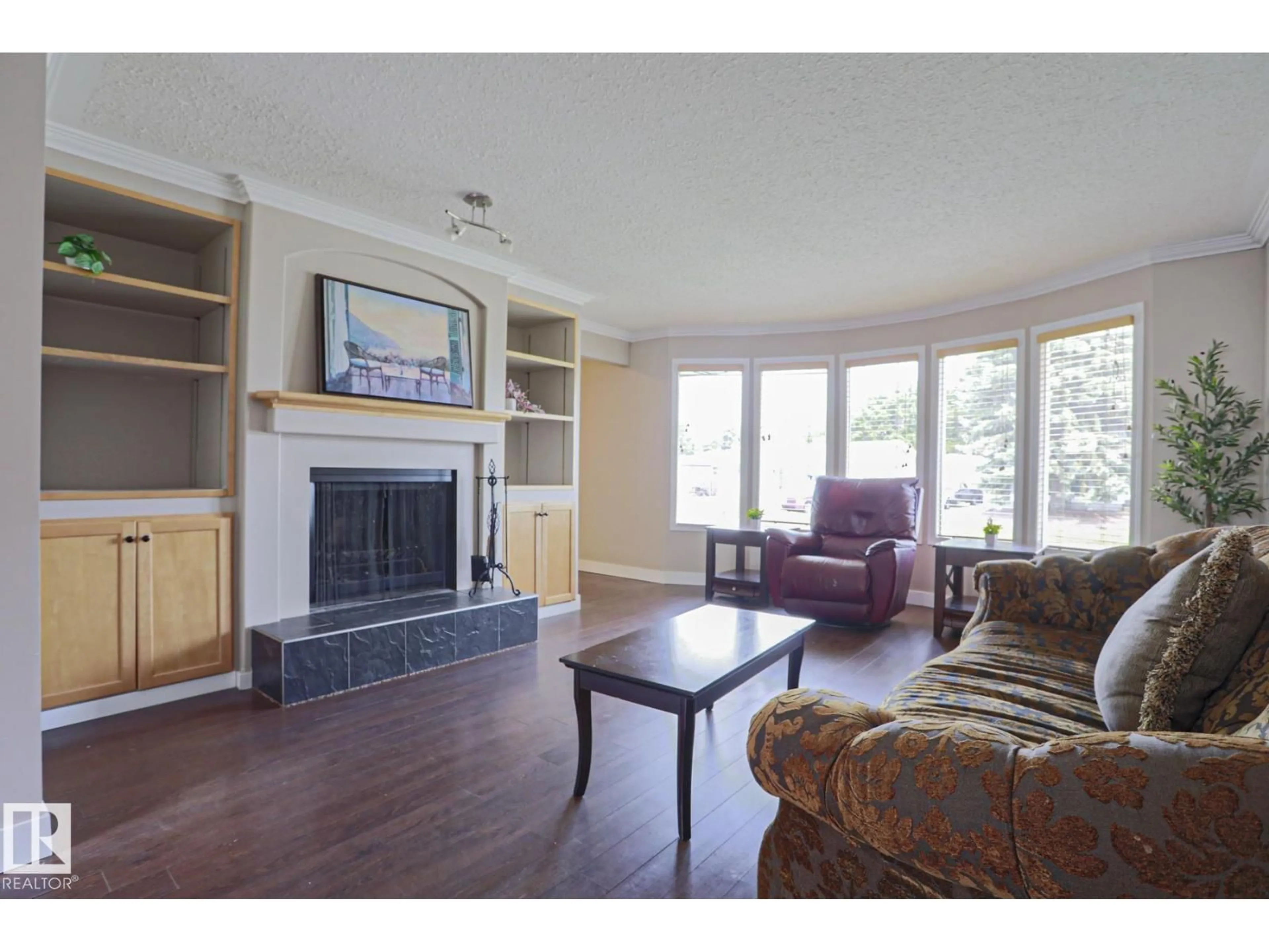 Living room with furniture, wood/laminate floor for 57 GARLAND CR, Sherwood Park Alberta T8A2P7