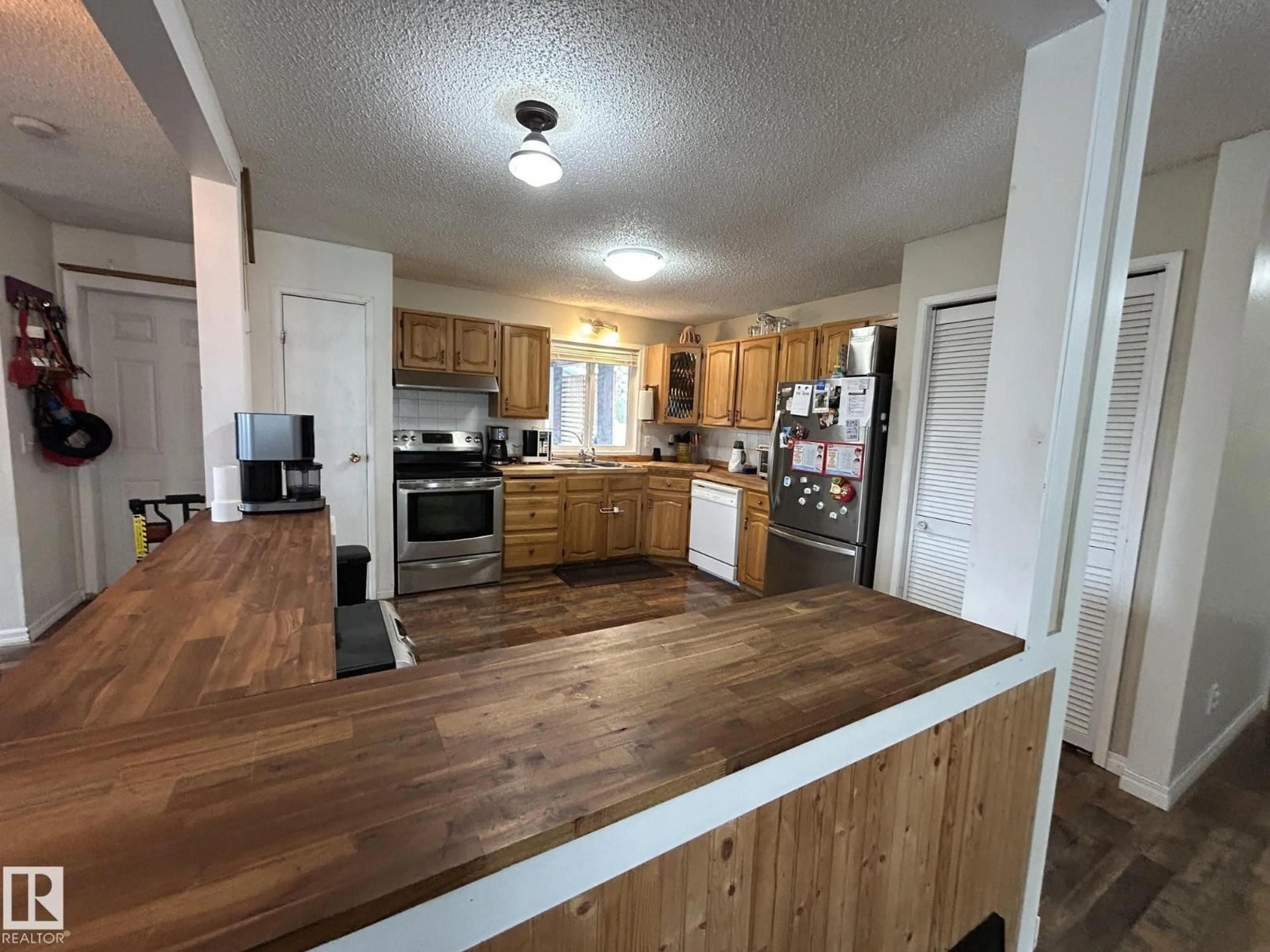 Open concept kitchen, wood/laminate floor for 5337 65 STREET, Redwater Alberta T0A2W0