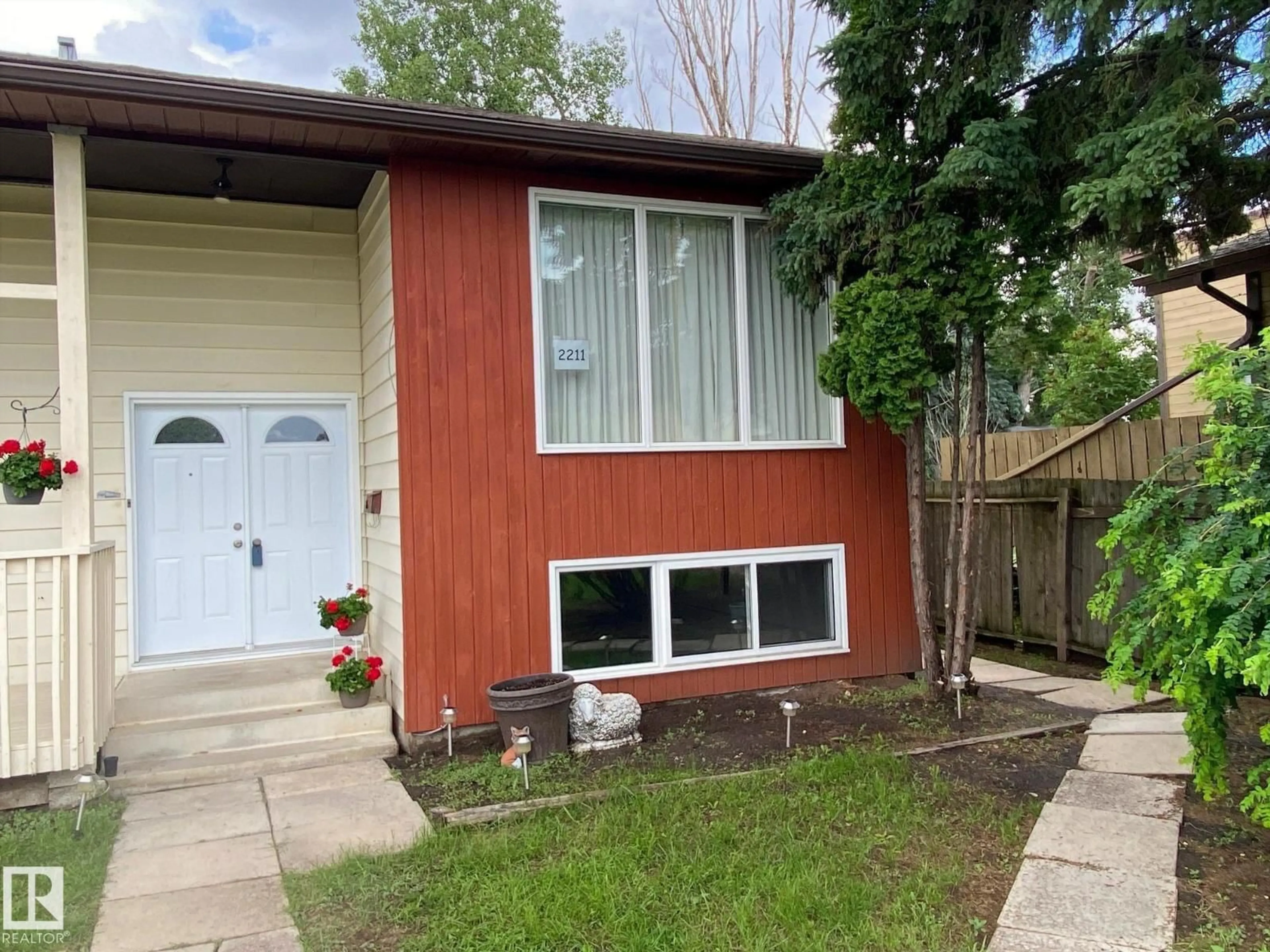 Home with vinyl exterior material, street for 2211 MILLBOURNE RD W, Edmonton Alberta T6K0Y3