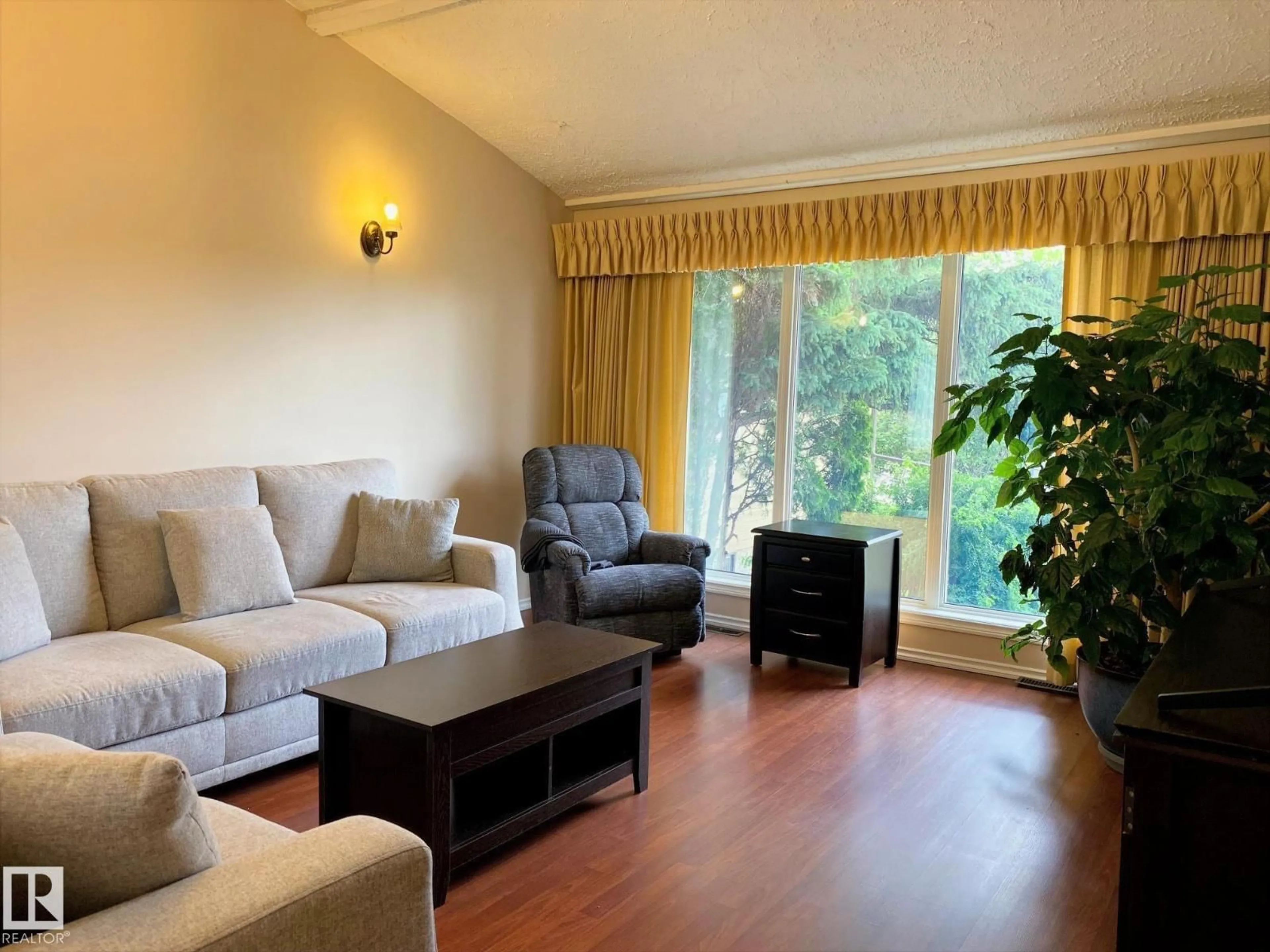 Living room with furniture, wood/laminate floor for 2211 MILLBOURNE RD W, Edmonton Alberta T6K0Y3