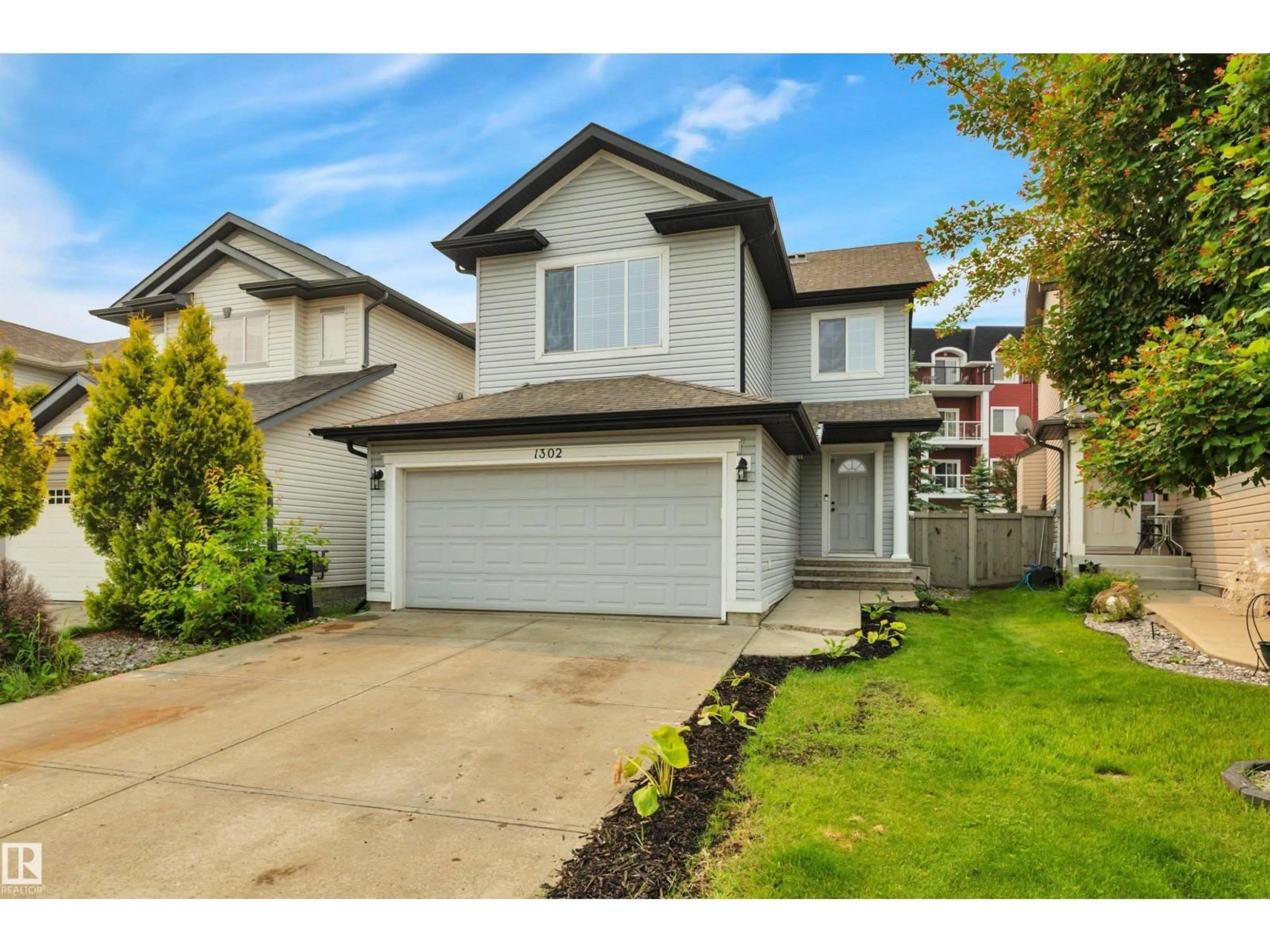 Home with vinyl exterior material, street for 1302 MCALLISTER WY, Edmonton Alberta T6W1R5