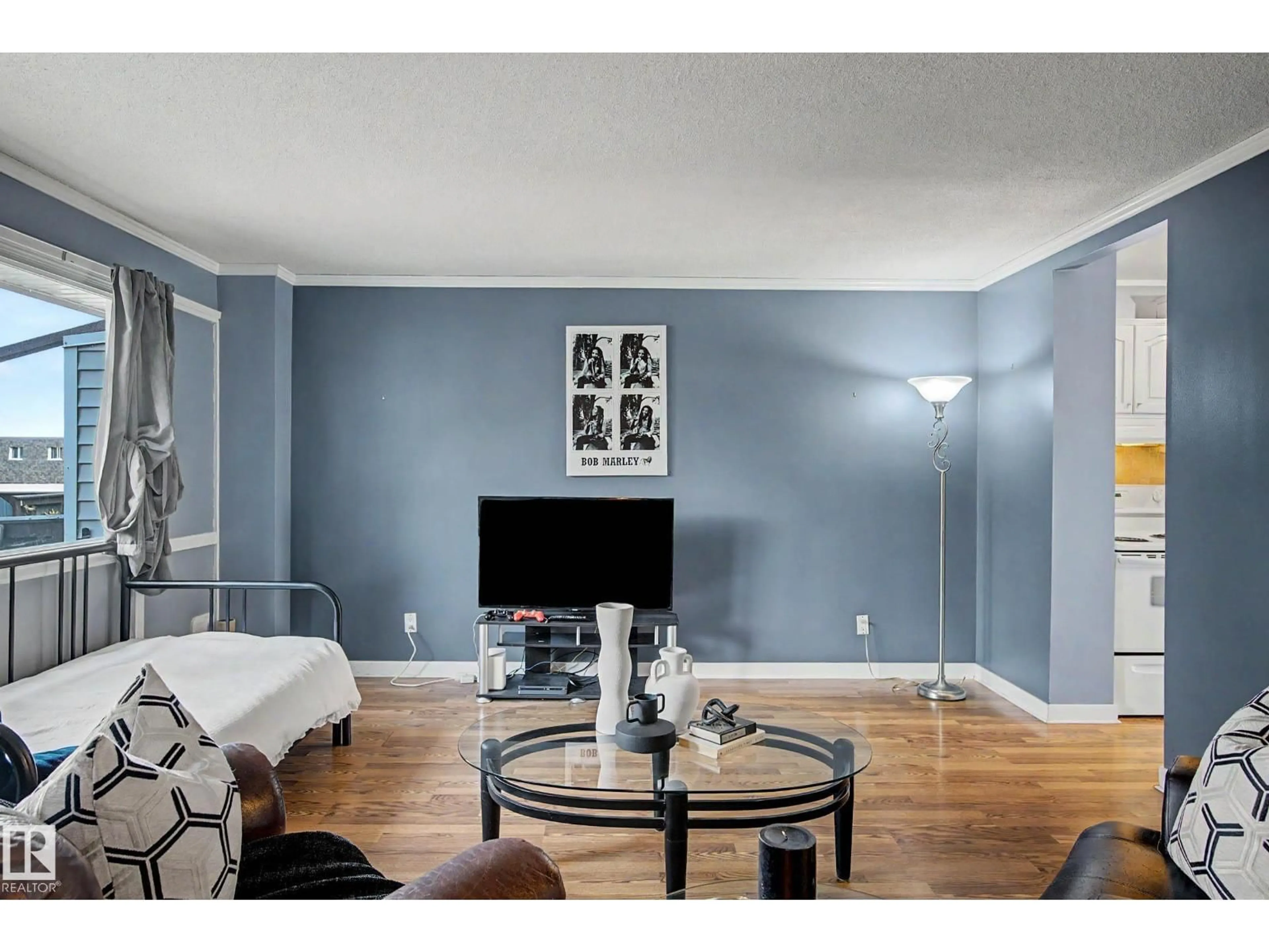 Living room with furniture, wood/laminate floor for NW - 219 VILLAGE ON THE GREEN GR, Edmonton Alberta T5A1H2