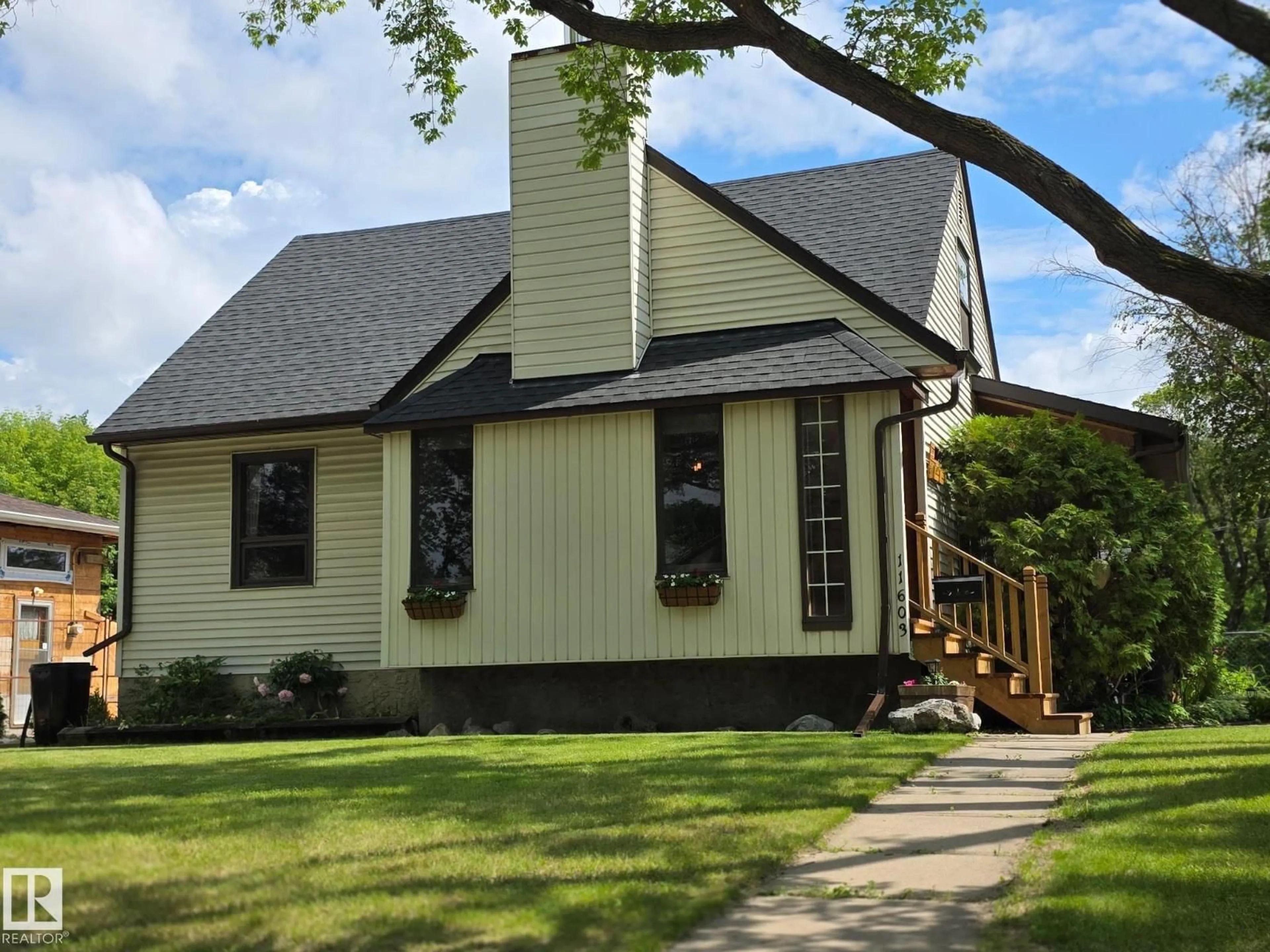 Home with vinyl exterior material, street for 11603 70 ST, Edmonton Alberta T5B1T6