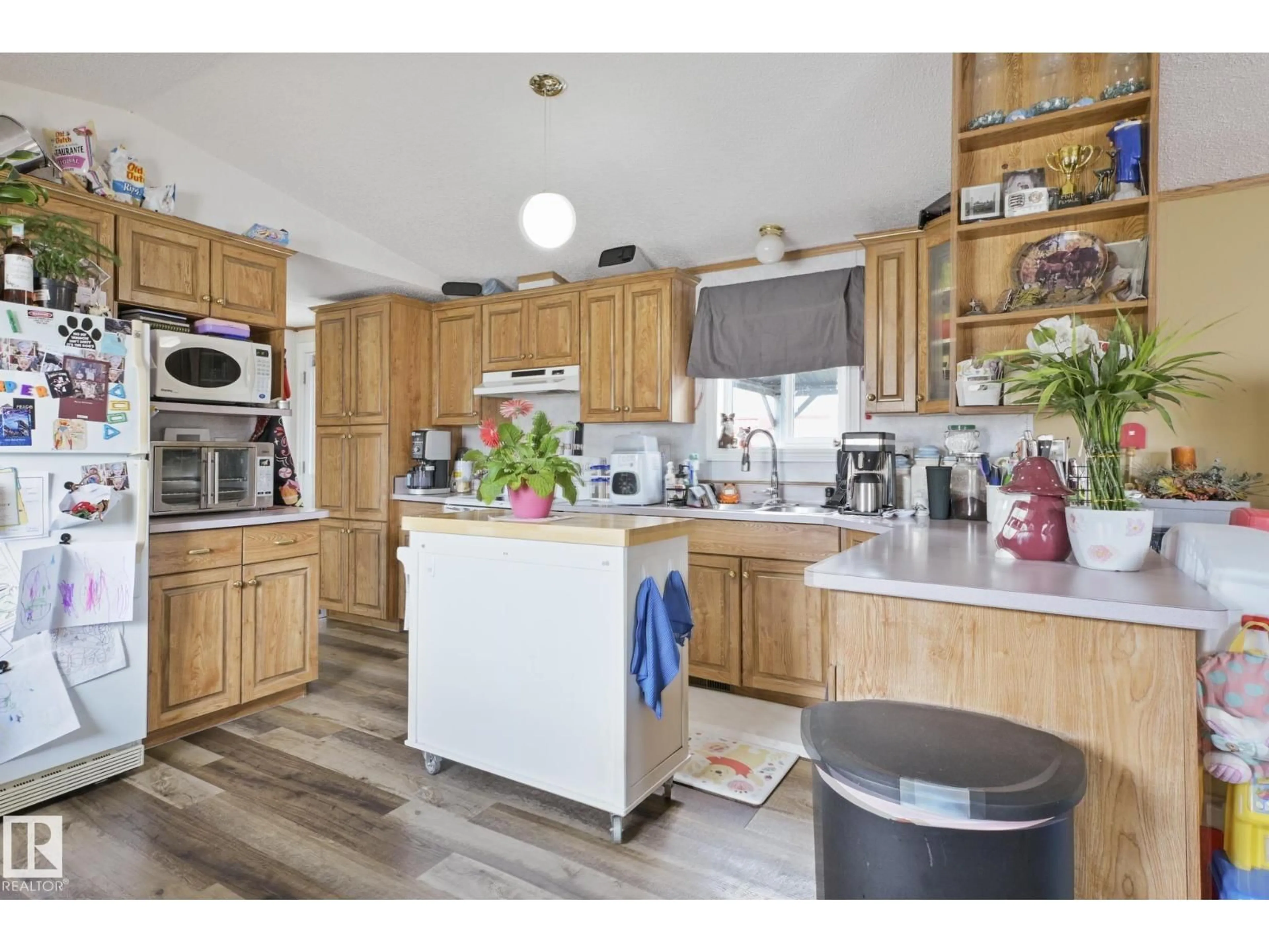 Open concept kitchen, wood/laminate floor for 4801 50 ST, Ardmore Alberta T0A0B0