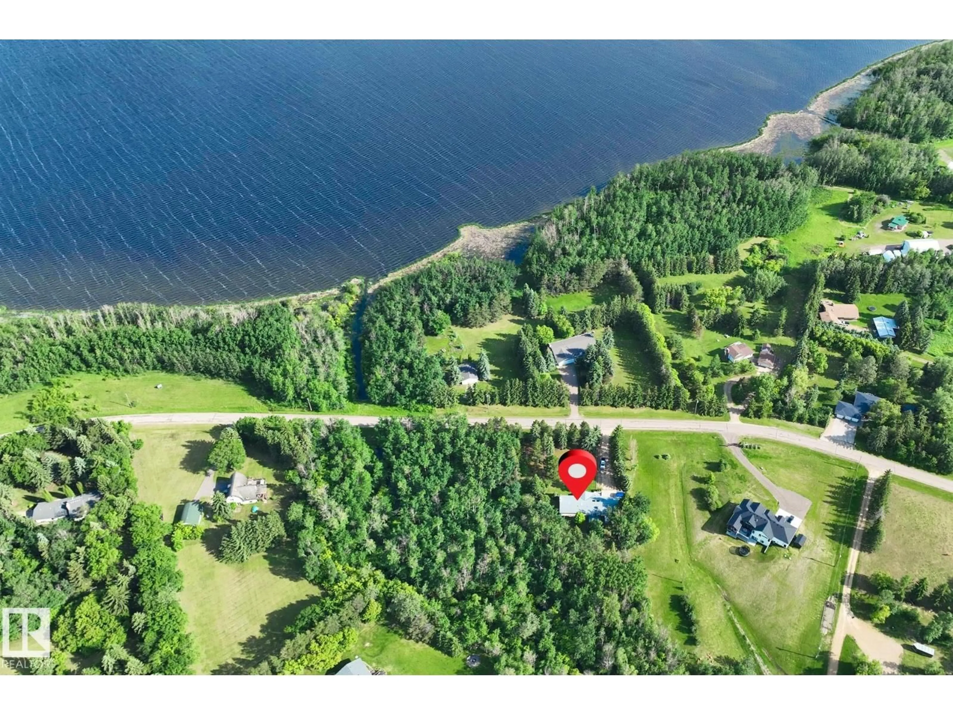 A pic from outside/outdoor area/front of a property/back of a property/a pic from drone, water/lake/river/ocean view for 404 - 22560 WYE RD, Rural Strathcona County Alberta T8A4T6