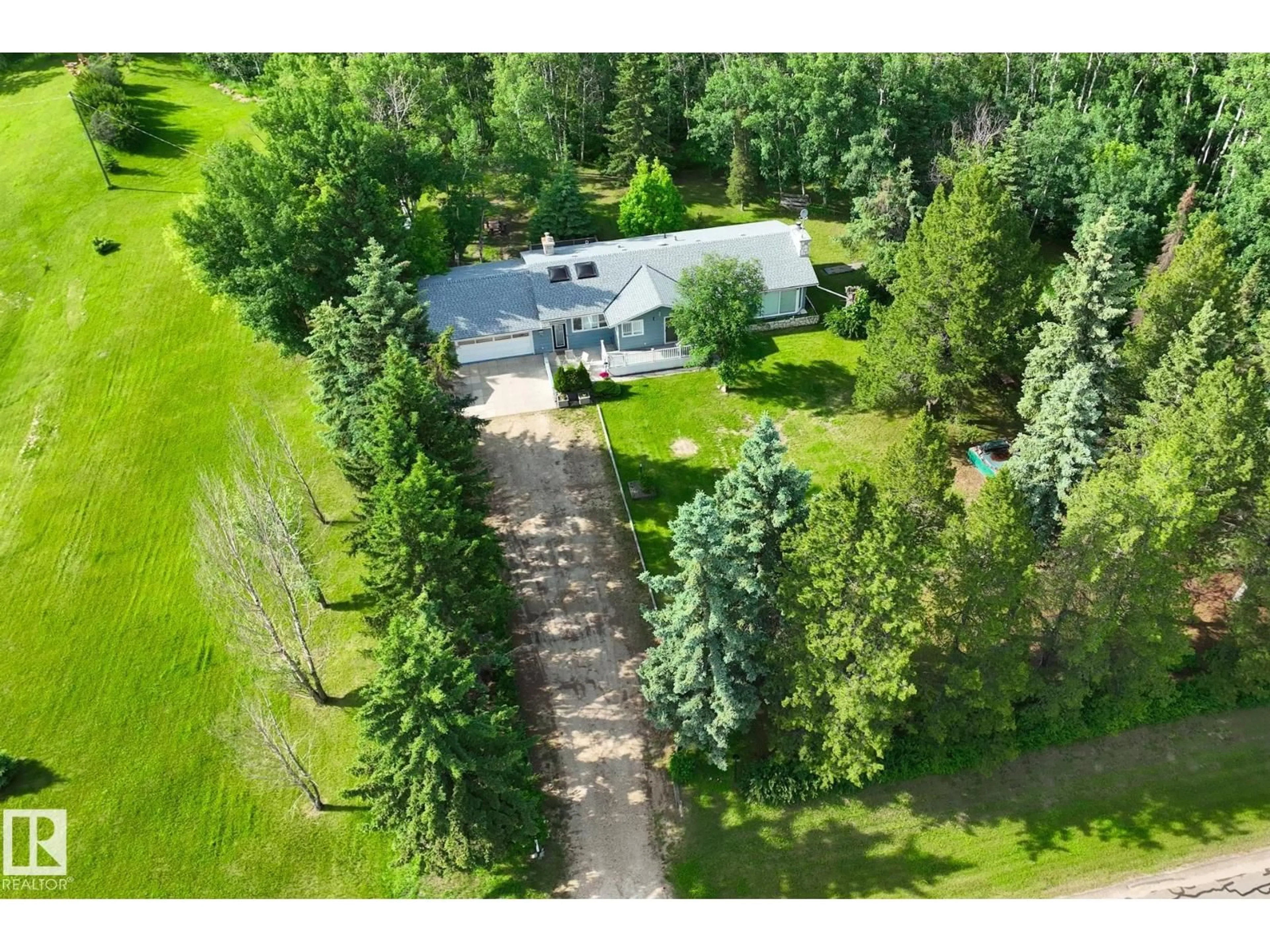 A pic from outside/outdoor area/front of a property/back of a property/a pic from drone, forest/trees view for 404 - 22560 WYE RD, Rural Strathcona County Alberta T8A4T6