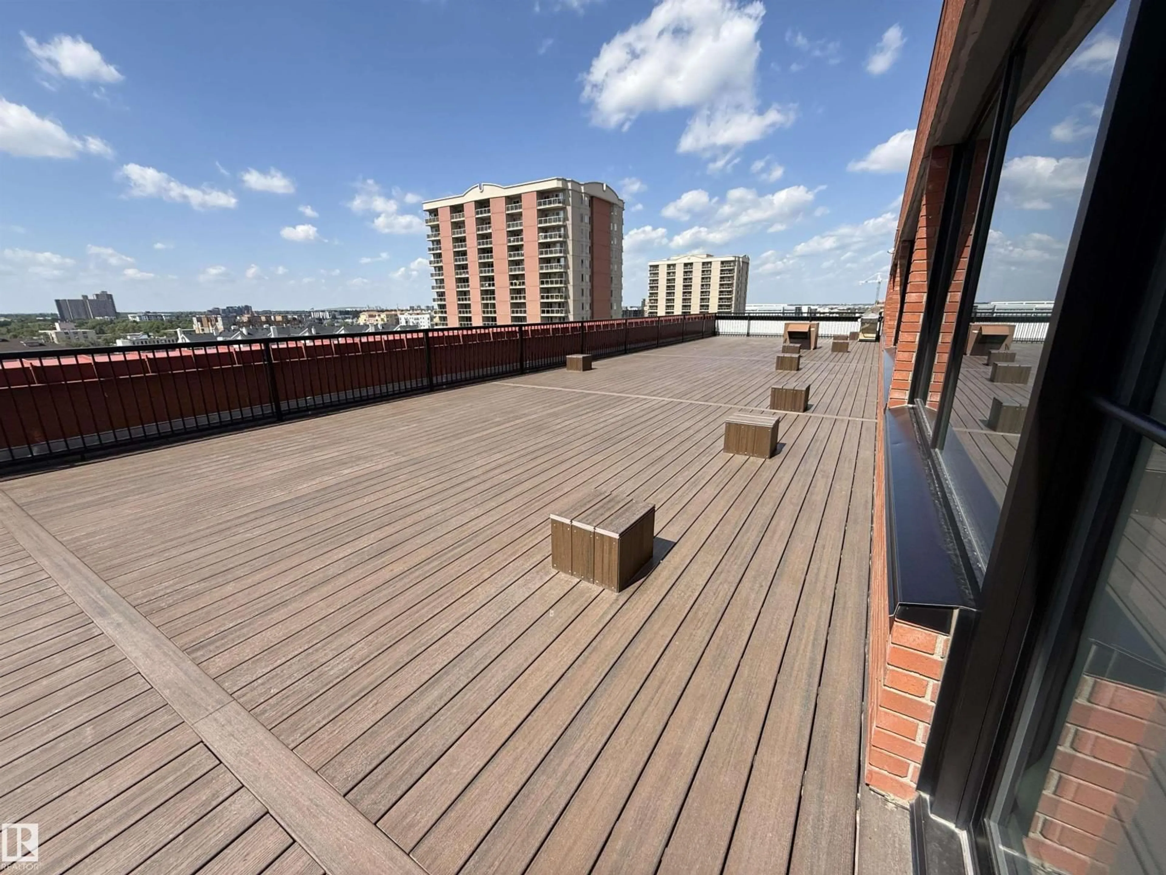 Patio, city buildings view from balcony for #409 - 10145 109 ST NW, Edmonton Alberta T5J3M5