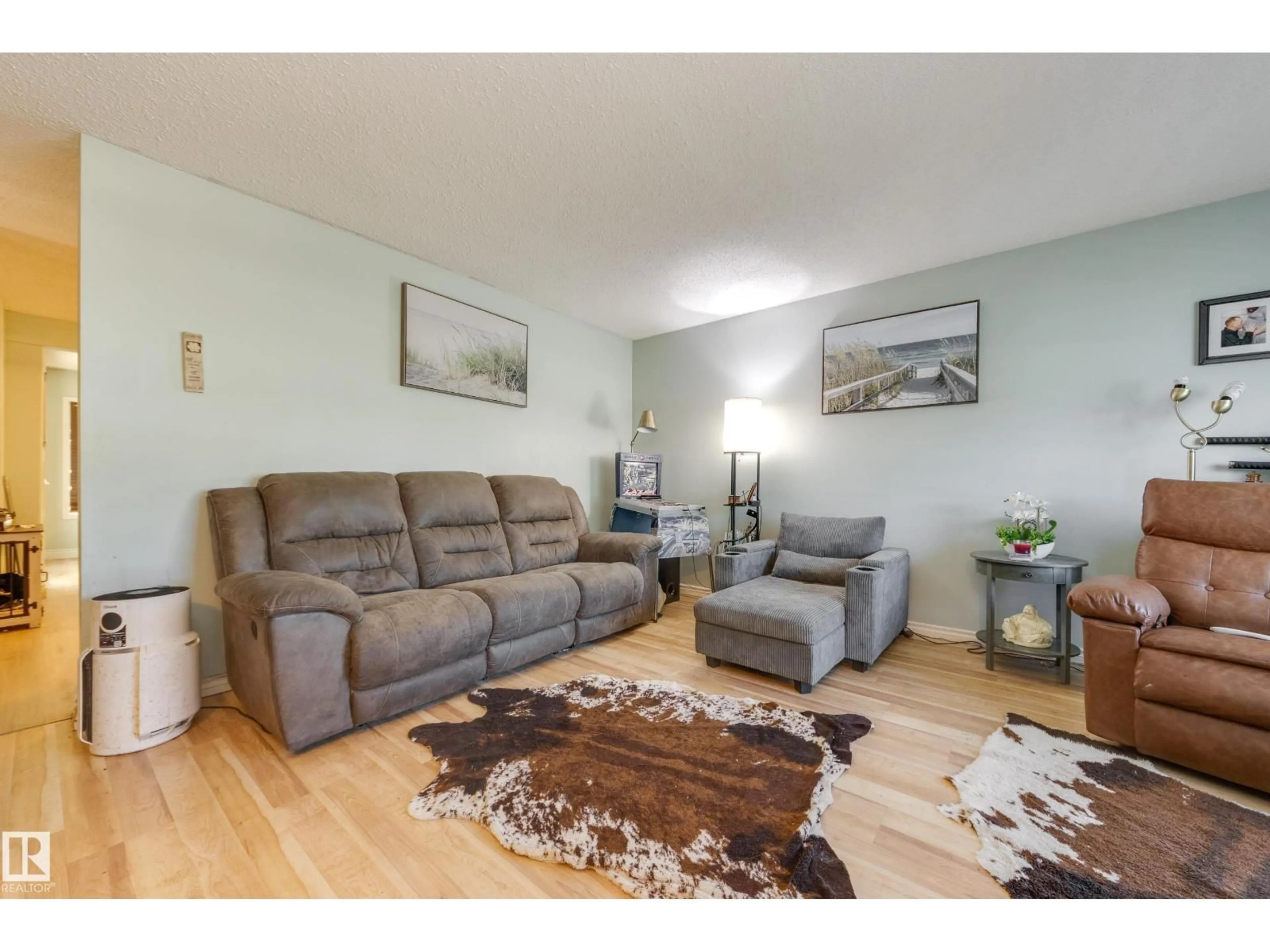Living room with furniture, wood/laminate floor for 17328 106 ST, Edmonton Alberta T5X3G8