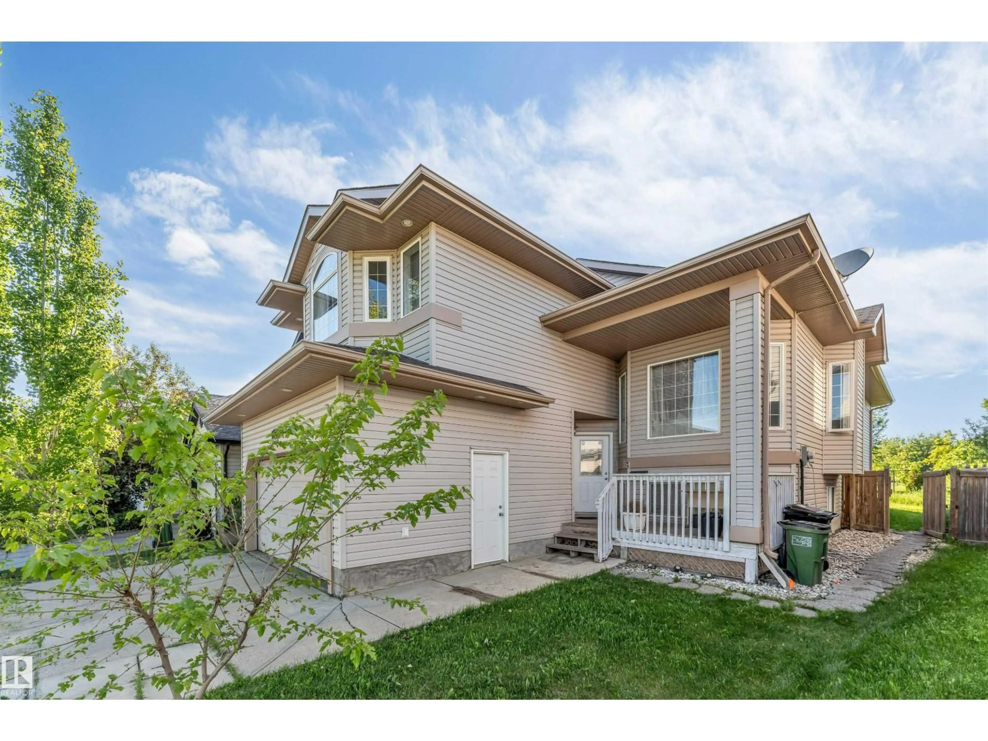 Home with vinyl exterior material, street for 7920 7 AV, Edmonton Alberta T6X1N3