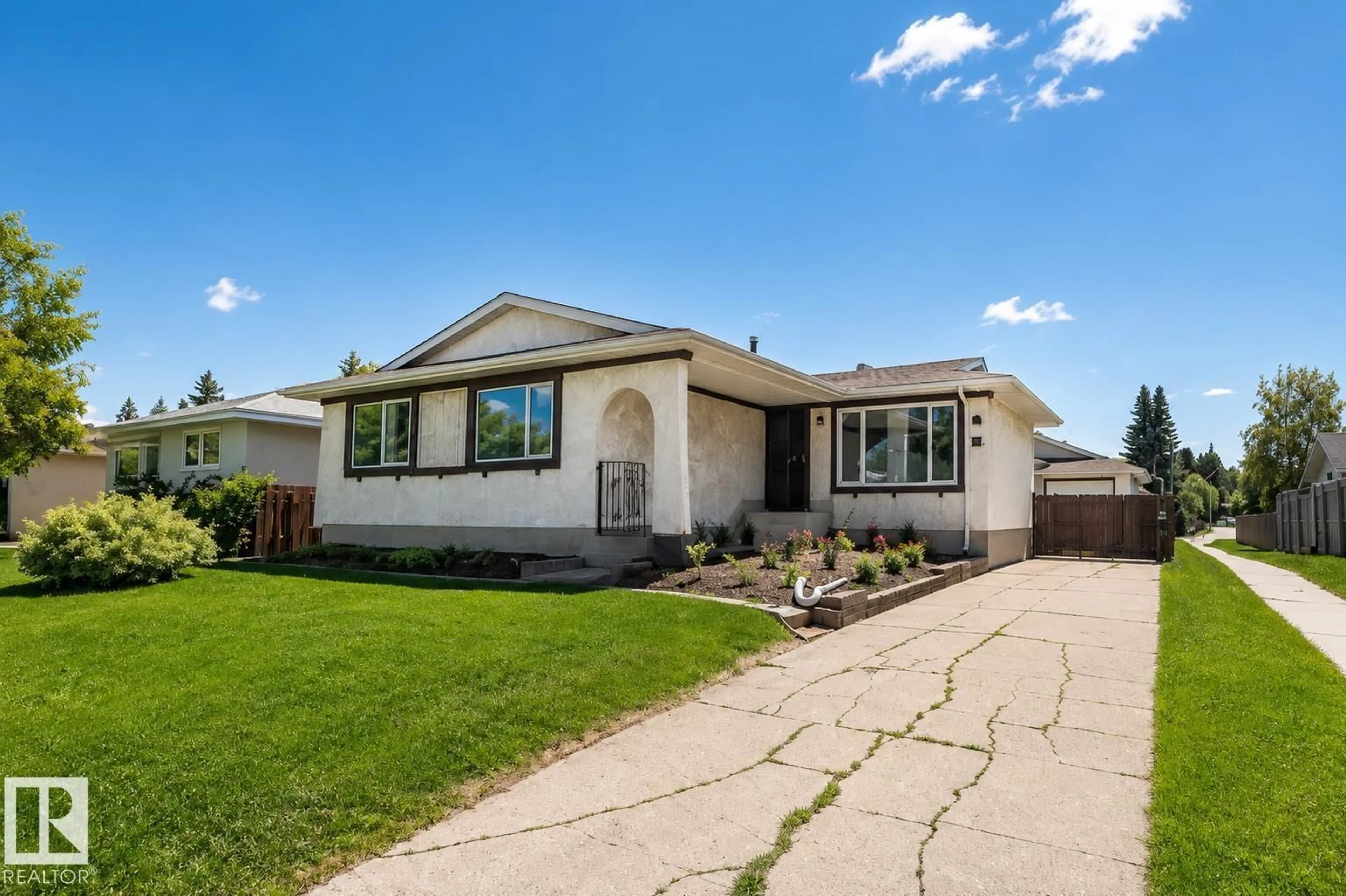 Home with vinyl exterior material, street for 10439 36A NW, Edmonton Alberta T6J2H7