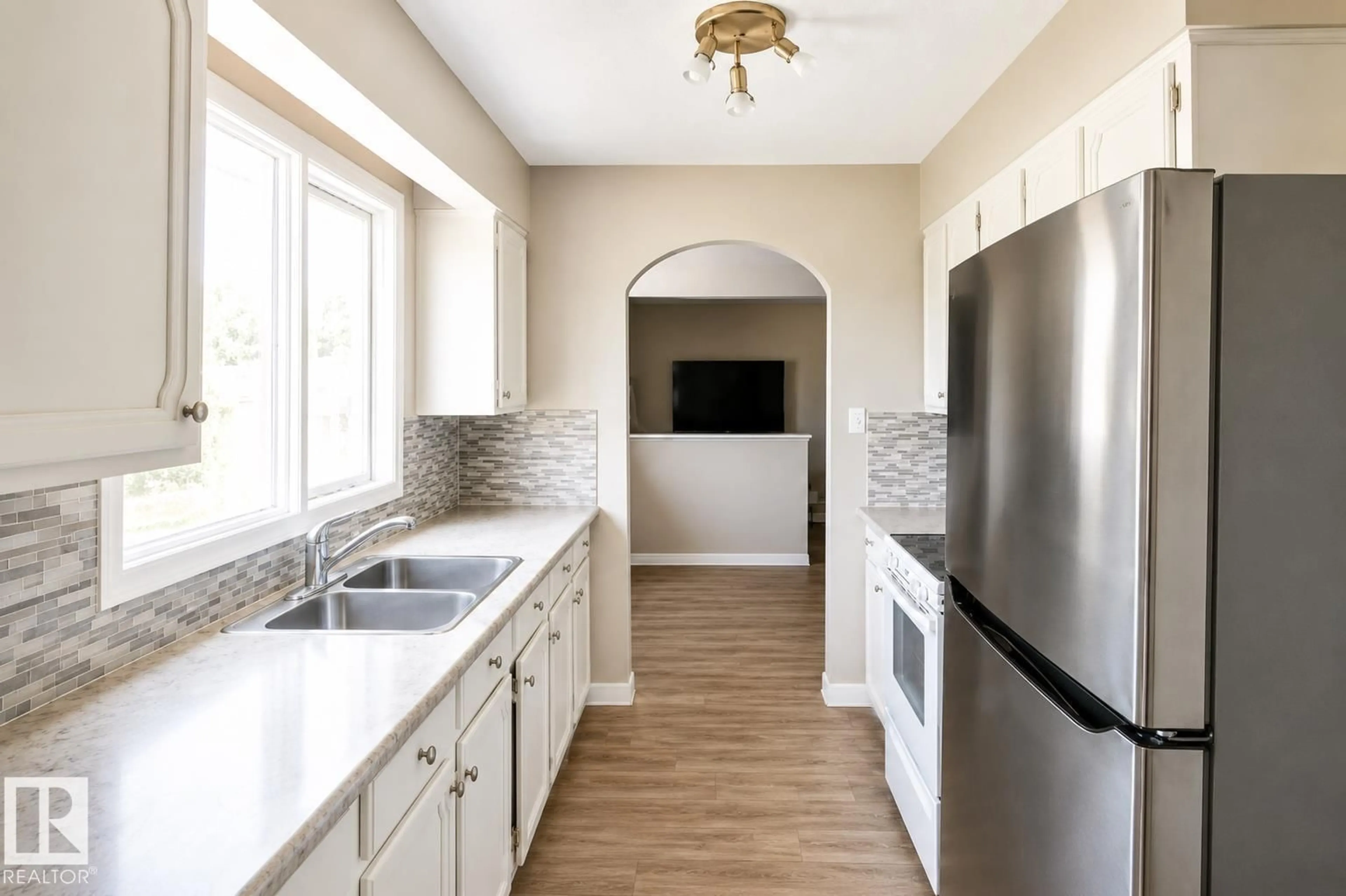 Open concept kitchen, ceramic/tile floor for 10439 36A NW, Edmonton Alberta T6J2H7