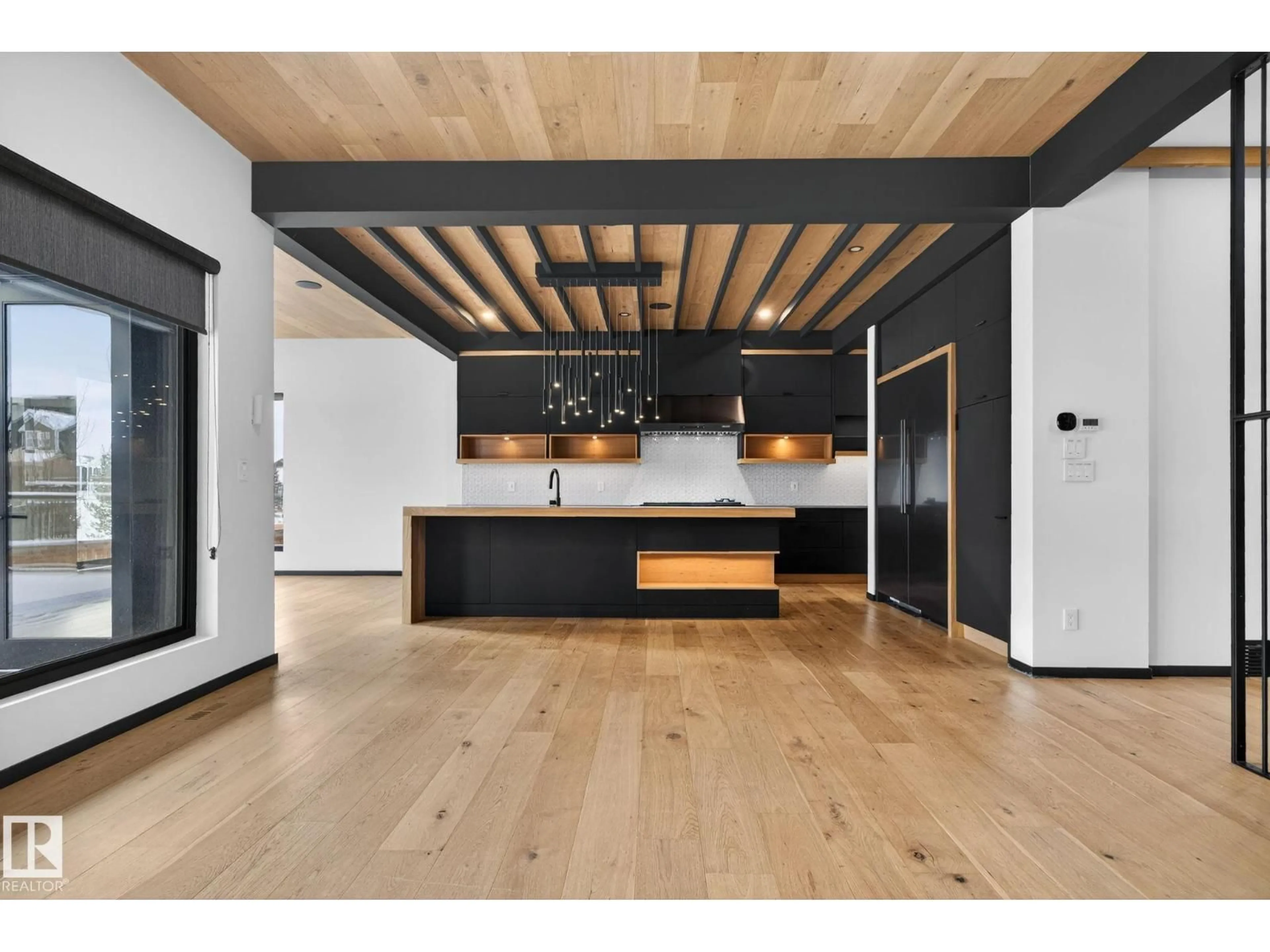 Open concept kitchen, wood/laminate floor for 104 EDGEWATER CI, Leduc Alberta T9E1K5