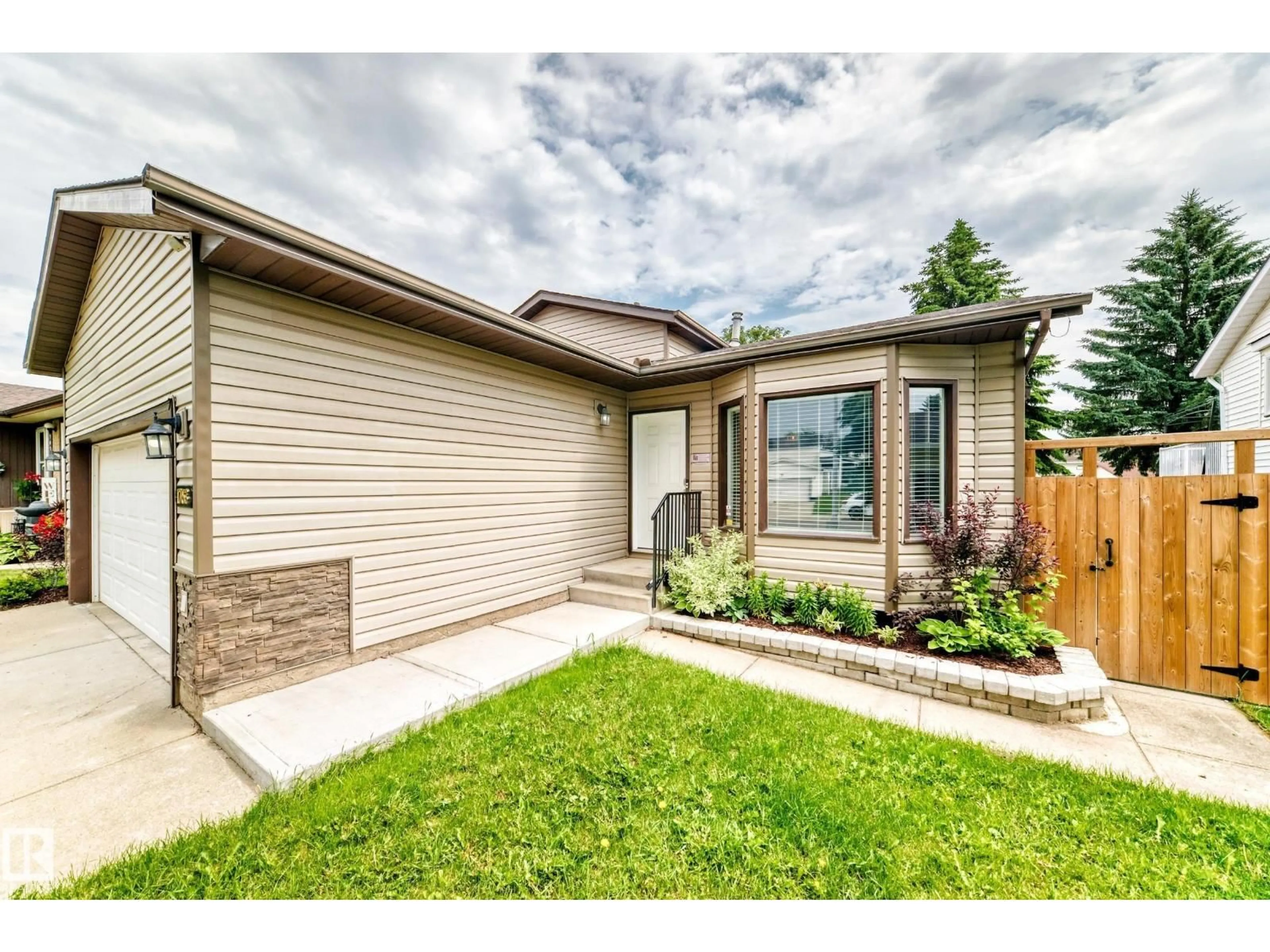 Home with brick exterior material, street for 1763 48A ST NW, Edmonton Alberta T6L2Y2