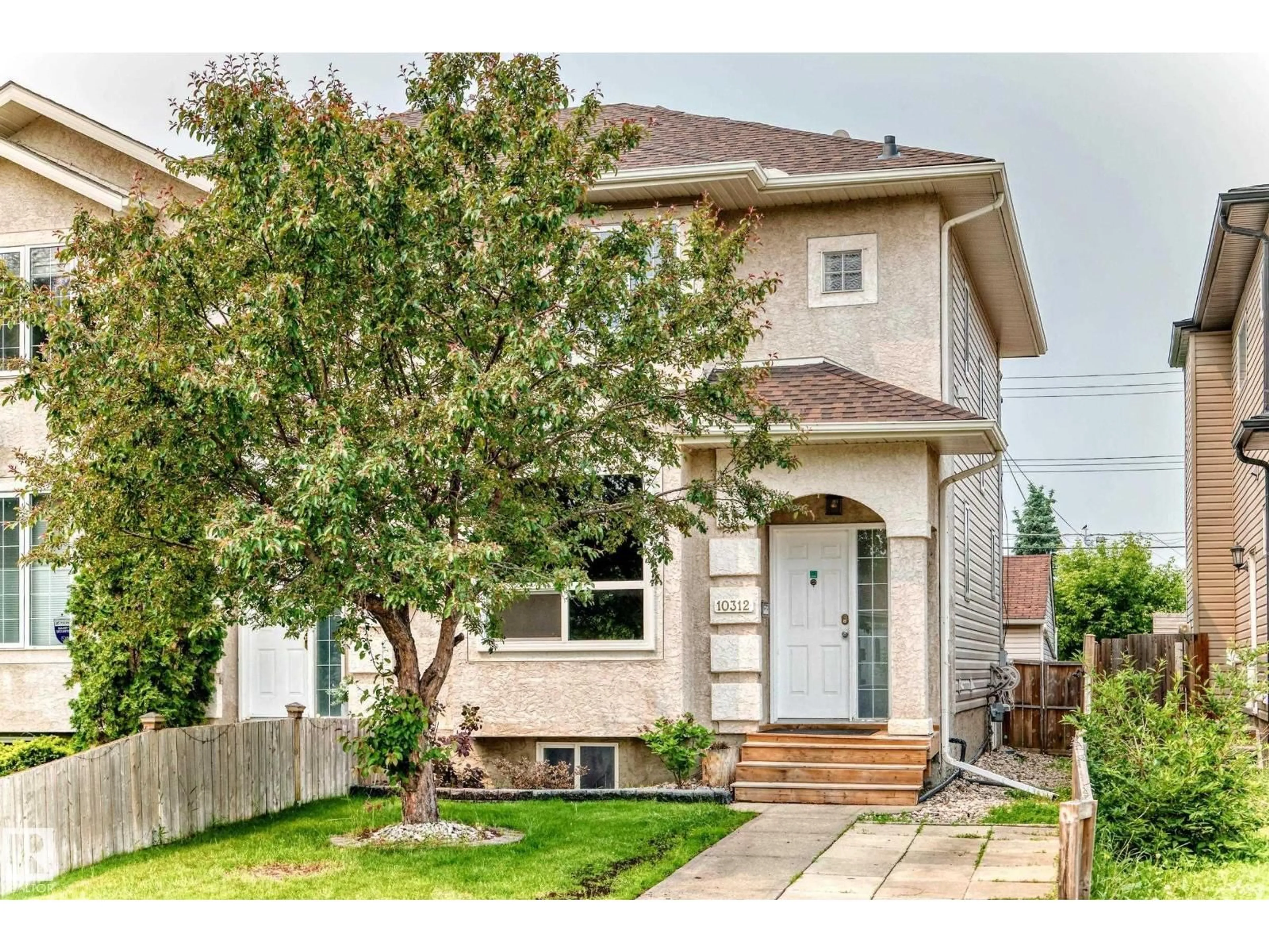 Home with vinyl exterior material, street for NW - 10312 162 ST, Edmonton Alberta T5P3M2