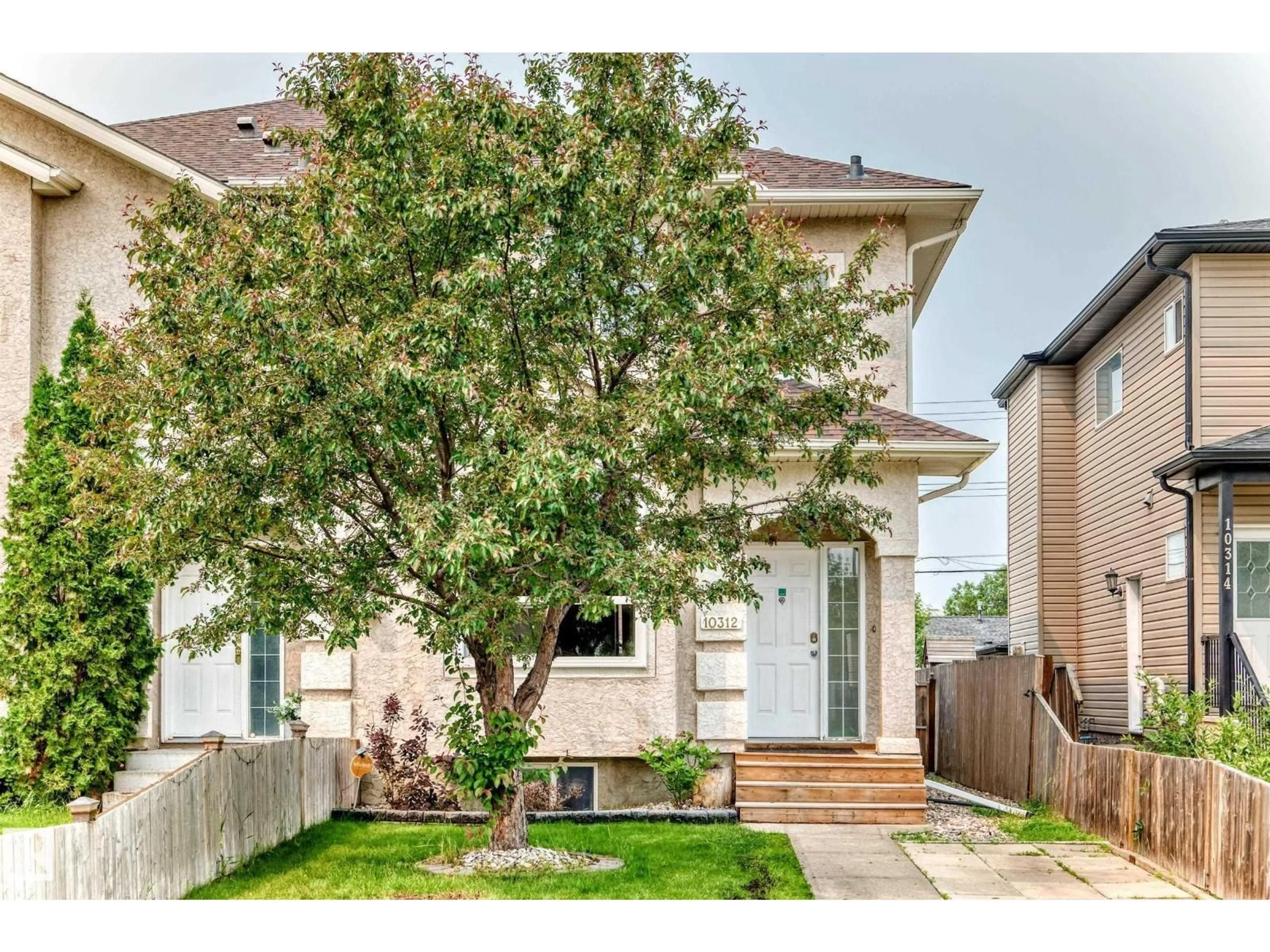 Home with vinyl exterior material, street for NW - 10312 162 ST, Edmonton Alberta T5P3M2