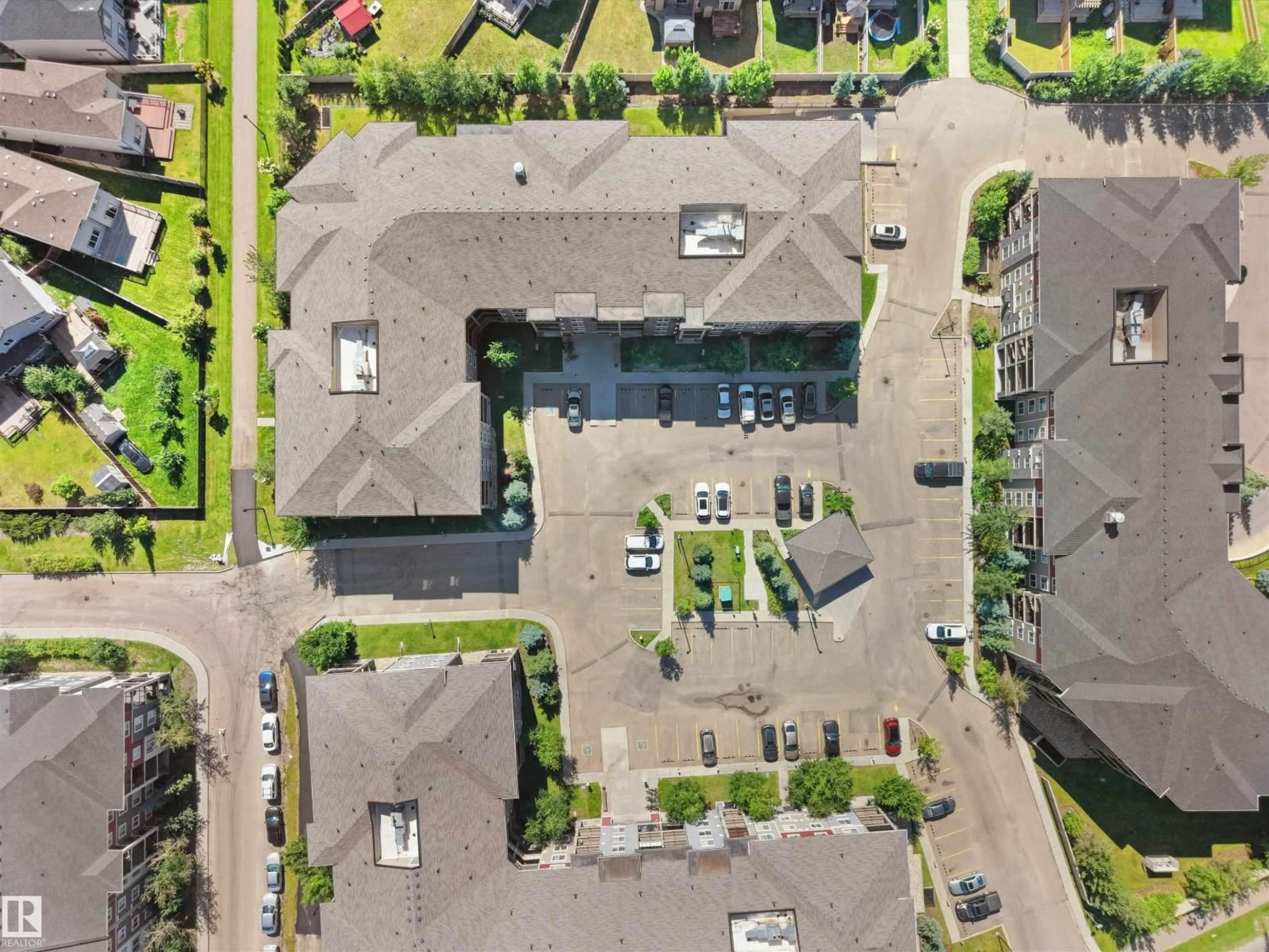 A pic from outside/outdoor area/front of a property/back of a property/a pic from drone, street for #211 - 3207 JAMES MOWATT TRAIL SW, Edmonton Alberta T6W3L6