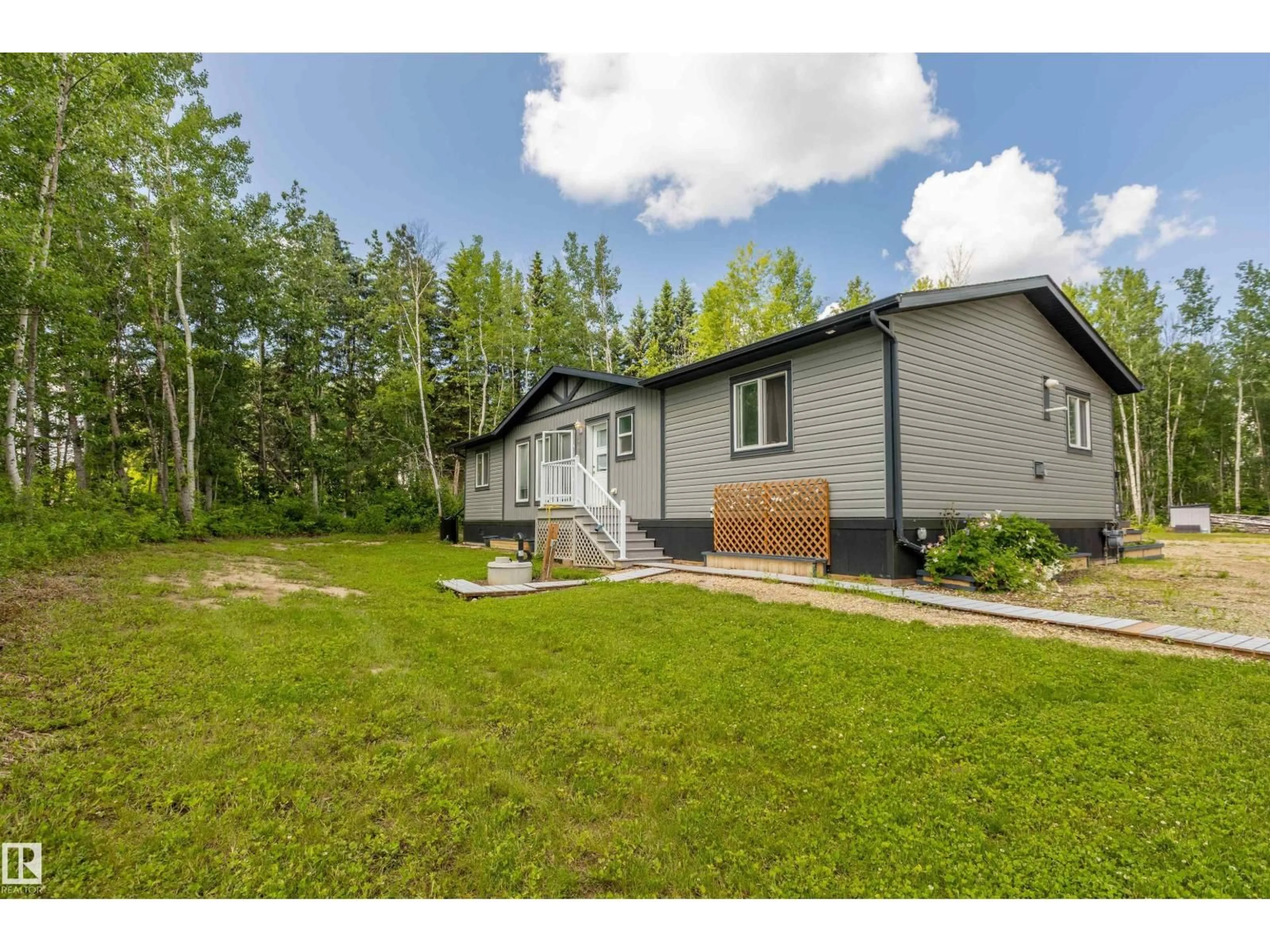 A pic from outside/outdoor area/front of a property/back of a property/a pic from drone, unknown for 55107 - 118 RGE ROAD 33, Rural Lac Ste. Anne County Alberta T0E1V0