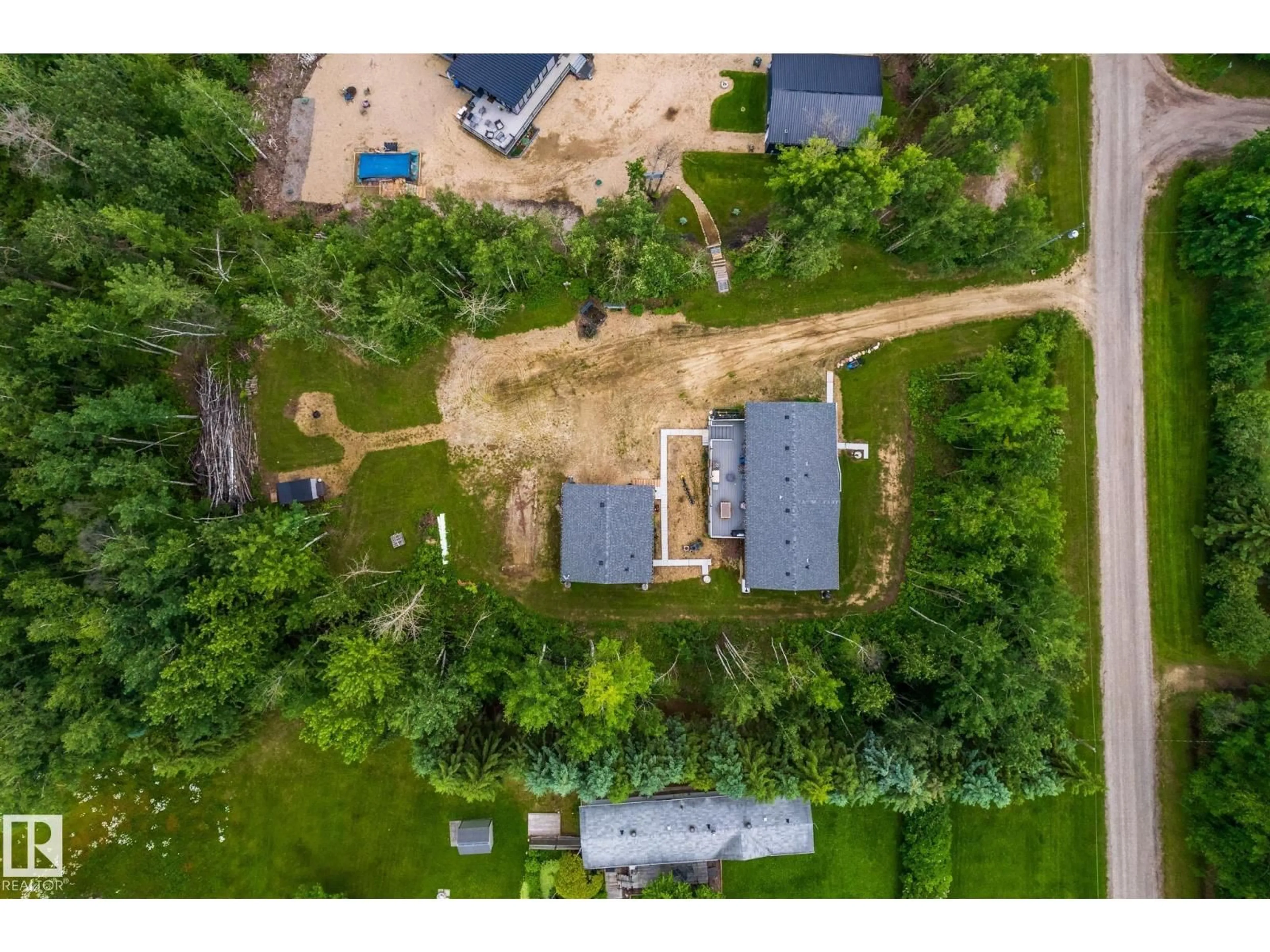 A pic from outside/outdoor area/front of a property/back of a property/a pic from drone, unknown for 55107 - 118 RGE ROAD 33, Rural Lac Ste. Anne County Alberta T0E1V0