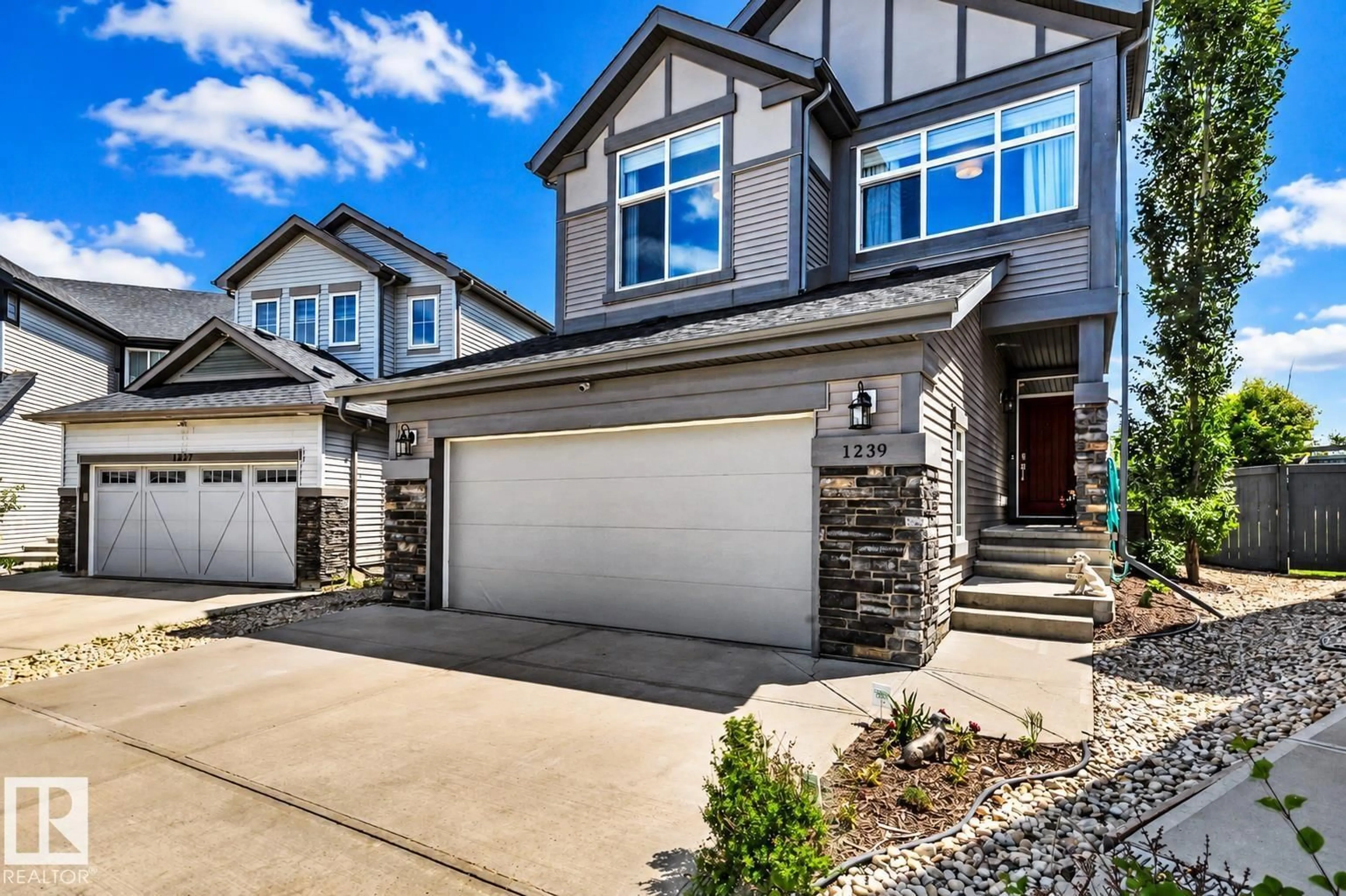 Home with vinyl exterior material, street for 1239 DANIELS CR, Edmonton Alberta T6W3V6