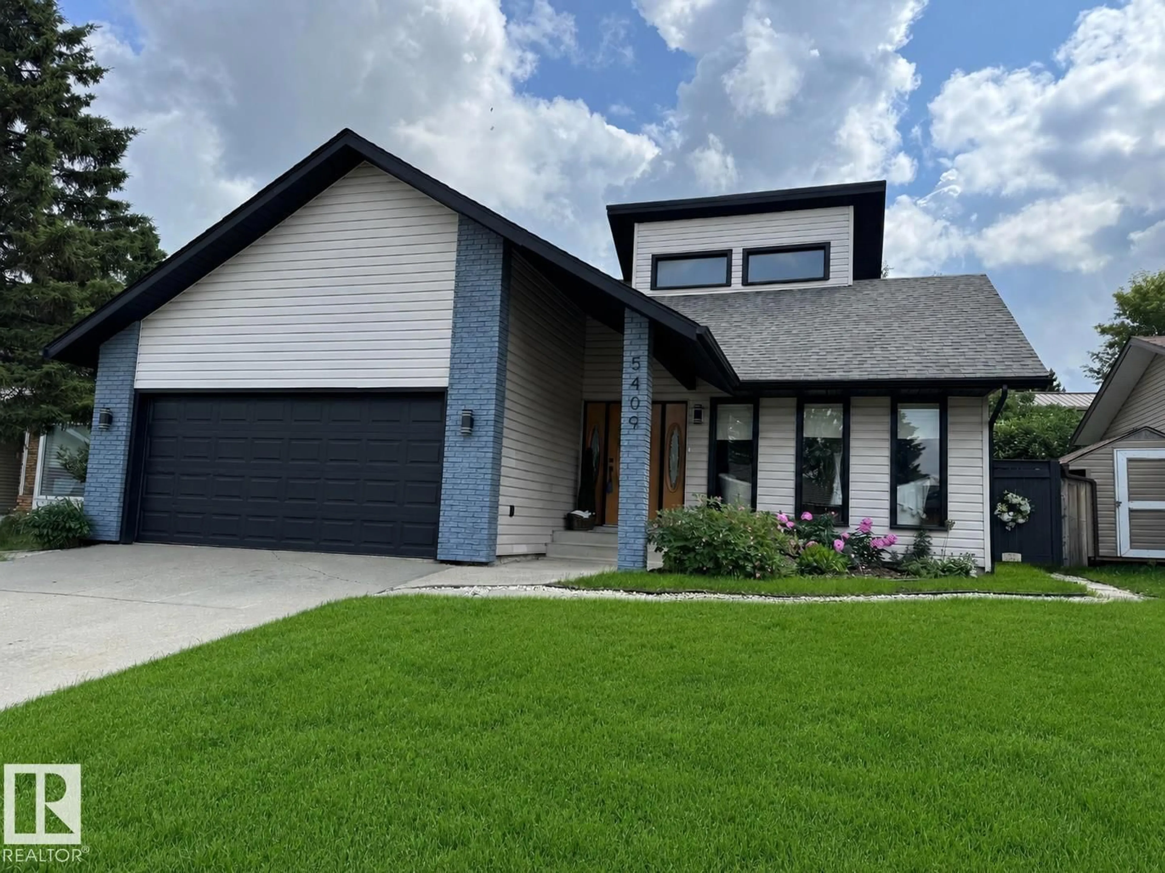 Home with vinyl exterior material, street for 5409 56 ST, Beaumont Alberta T4X1A5