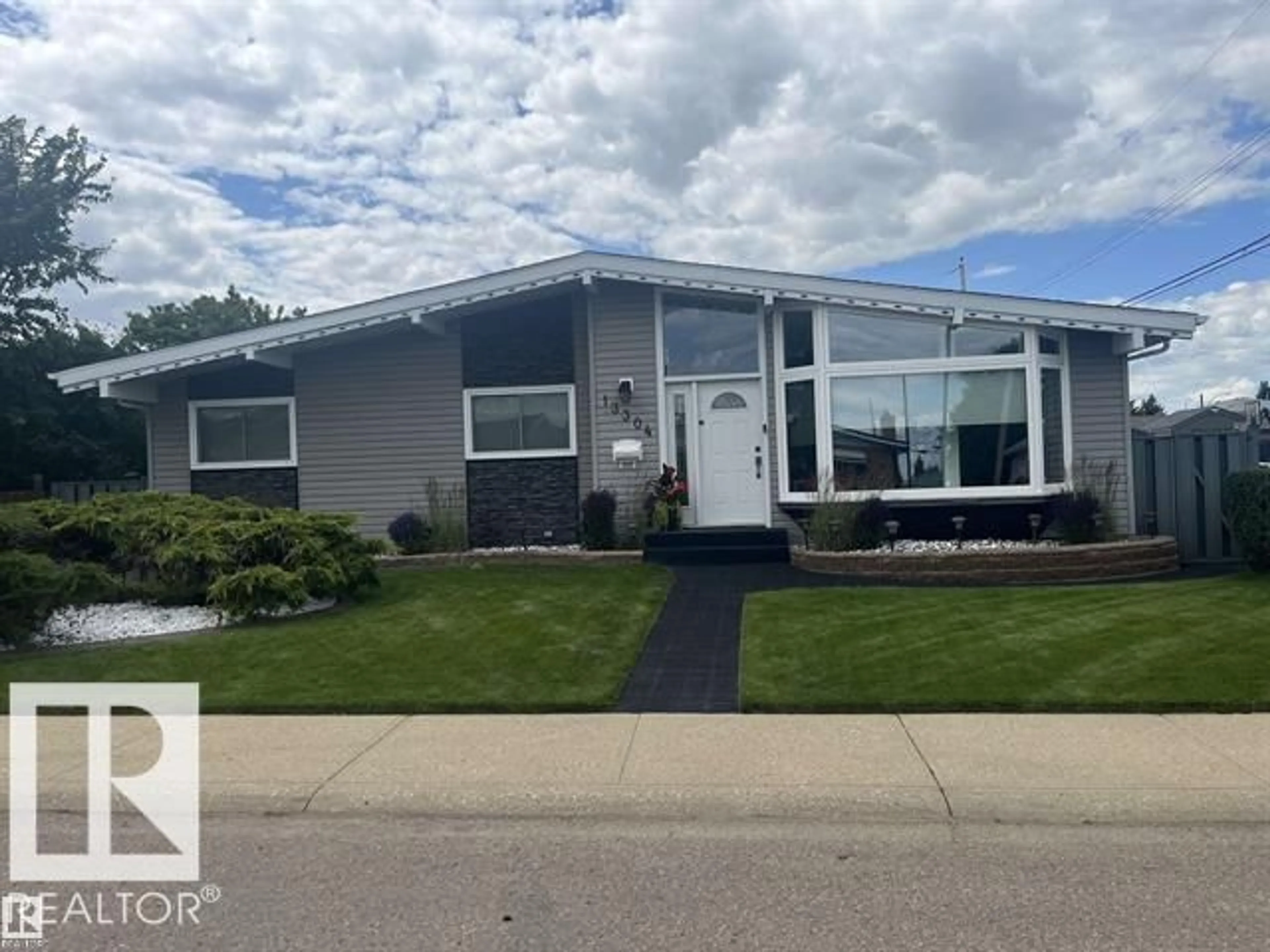 Home with vinyl exterior material, street for NW - 13304 70 ST, Edmonton Alberta T5C0K3