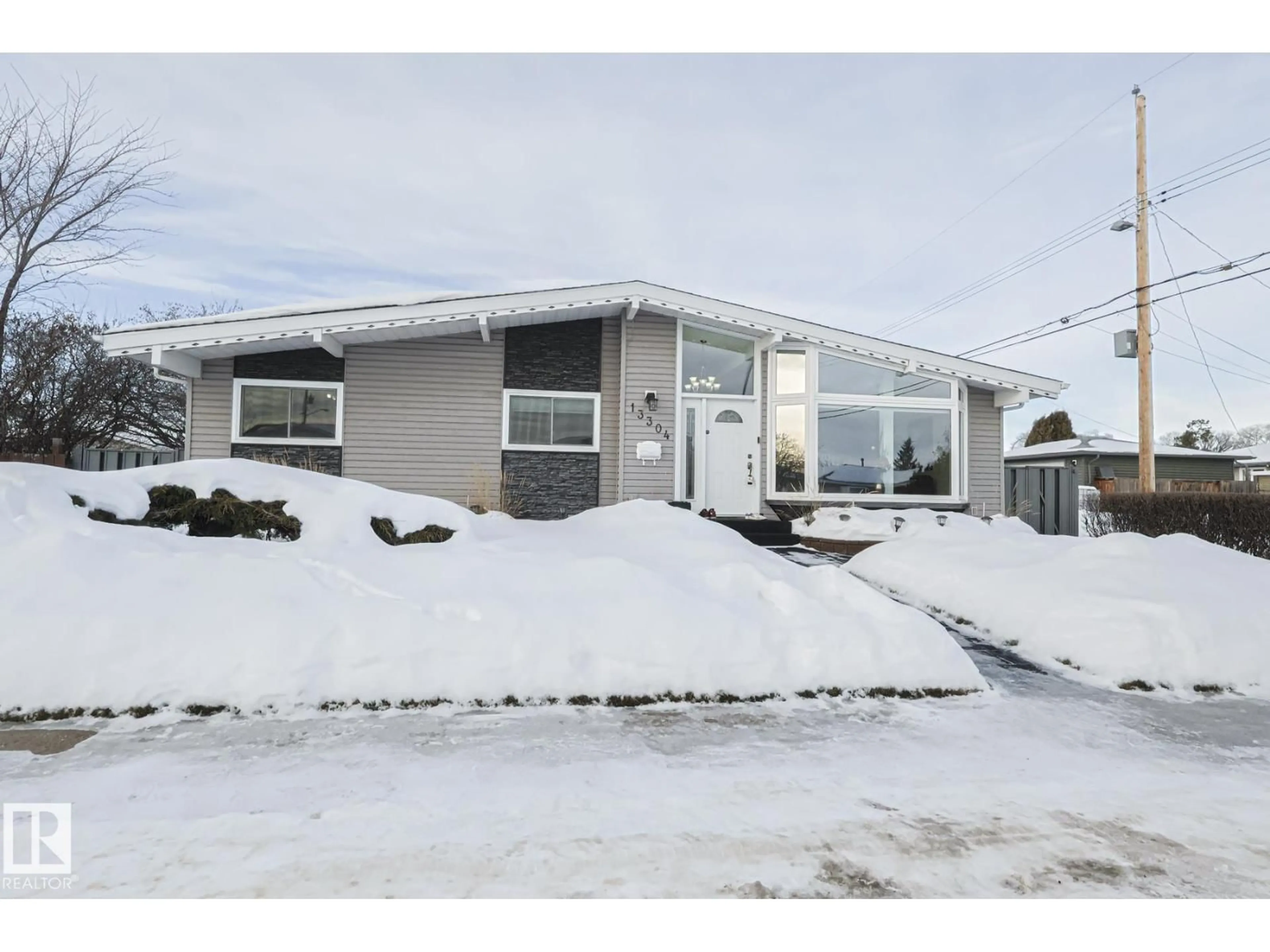 Home with vinyl exterior material, street for NW - 13304 70 ST, Edmonton Alberta T5C0K3