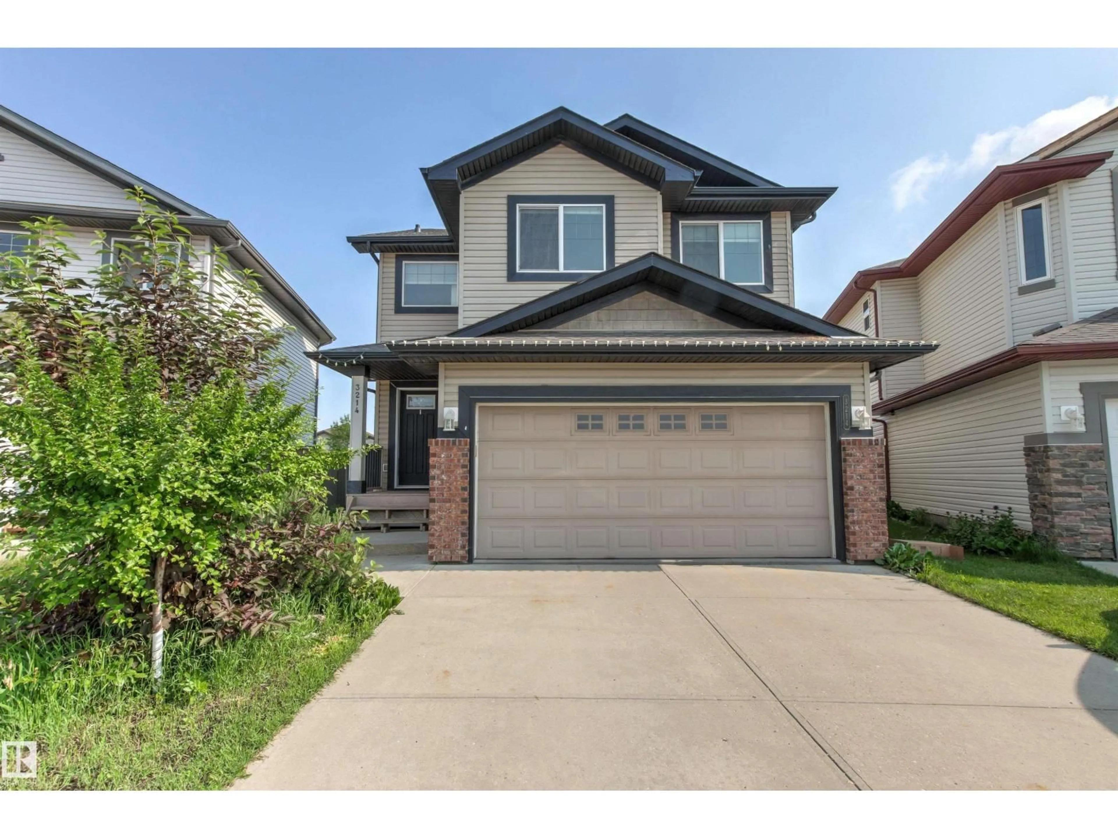 Home with vinyl exterior material, street for NW - 3214 22A AV, Edmonton Alberta T6T0K6