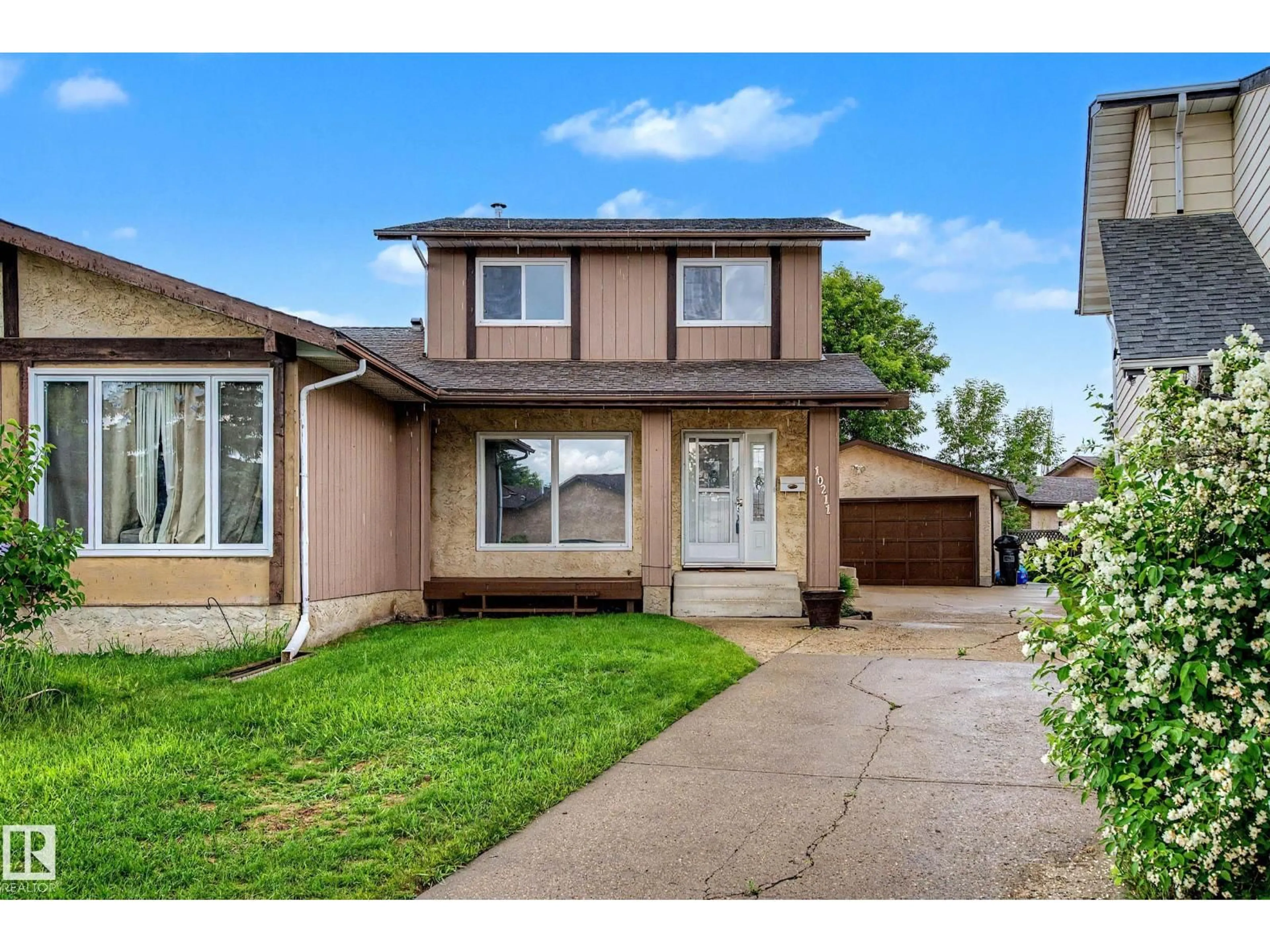 Home with vinyl exterior material, street for 10211 171A AV, Edmonton Alberta T5X4L3