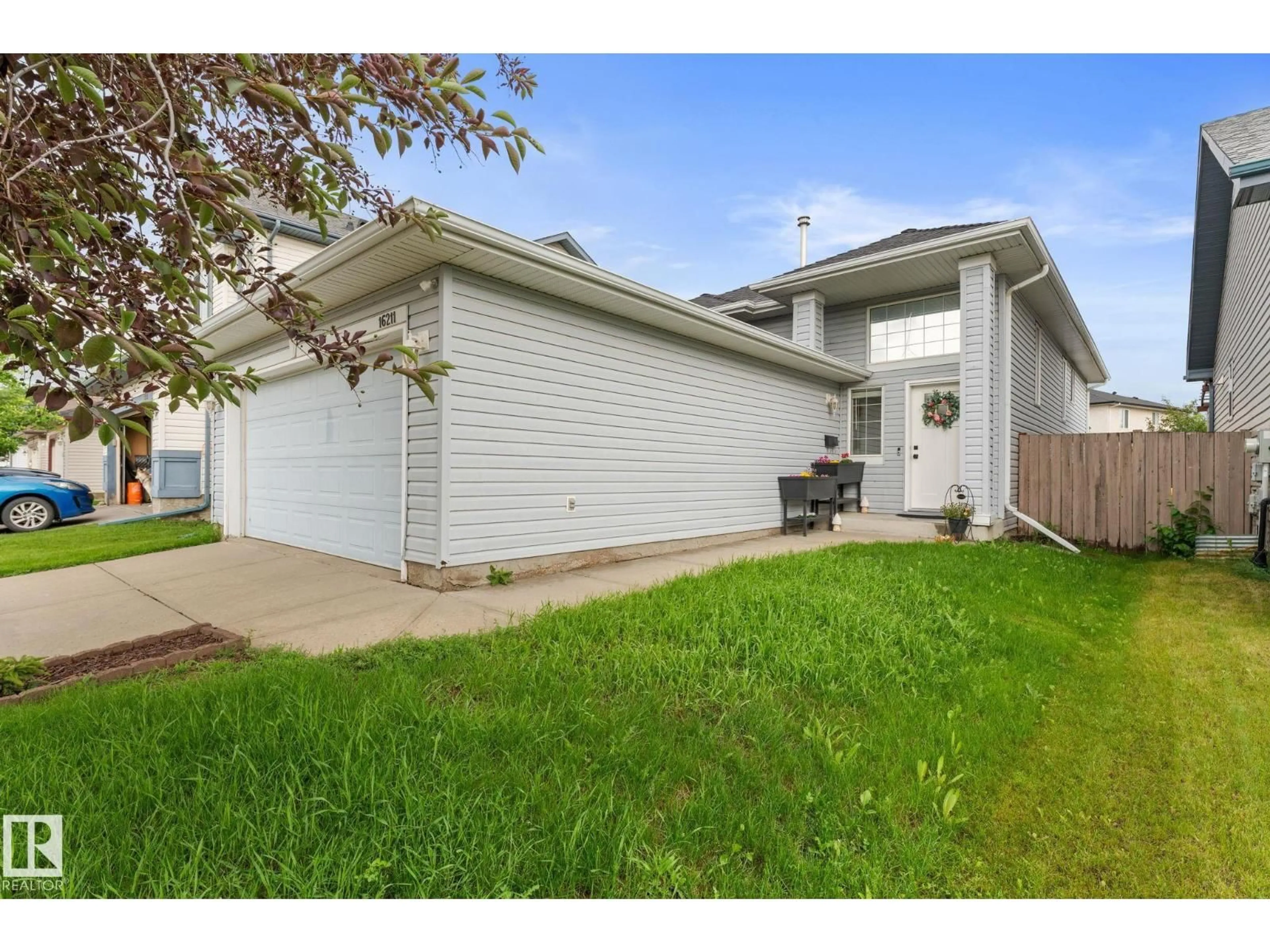 Home with vinyl exterior material, street for 16211 90 ST, Edmonton Alberta T5Z3P5