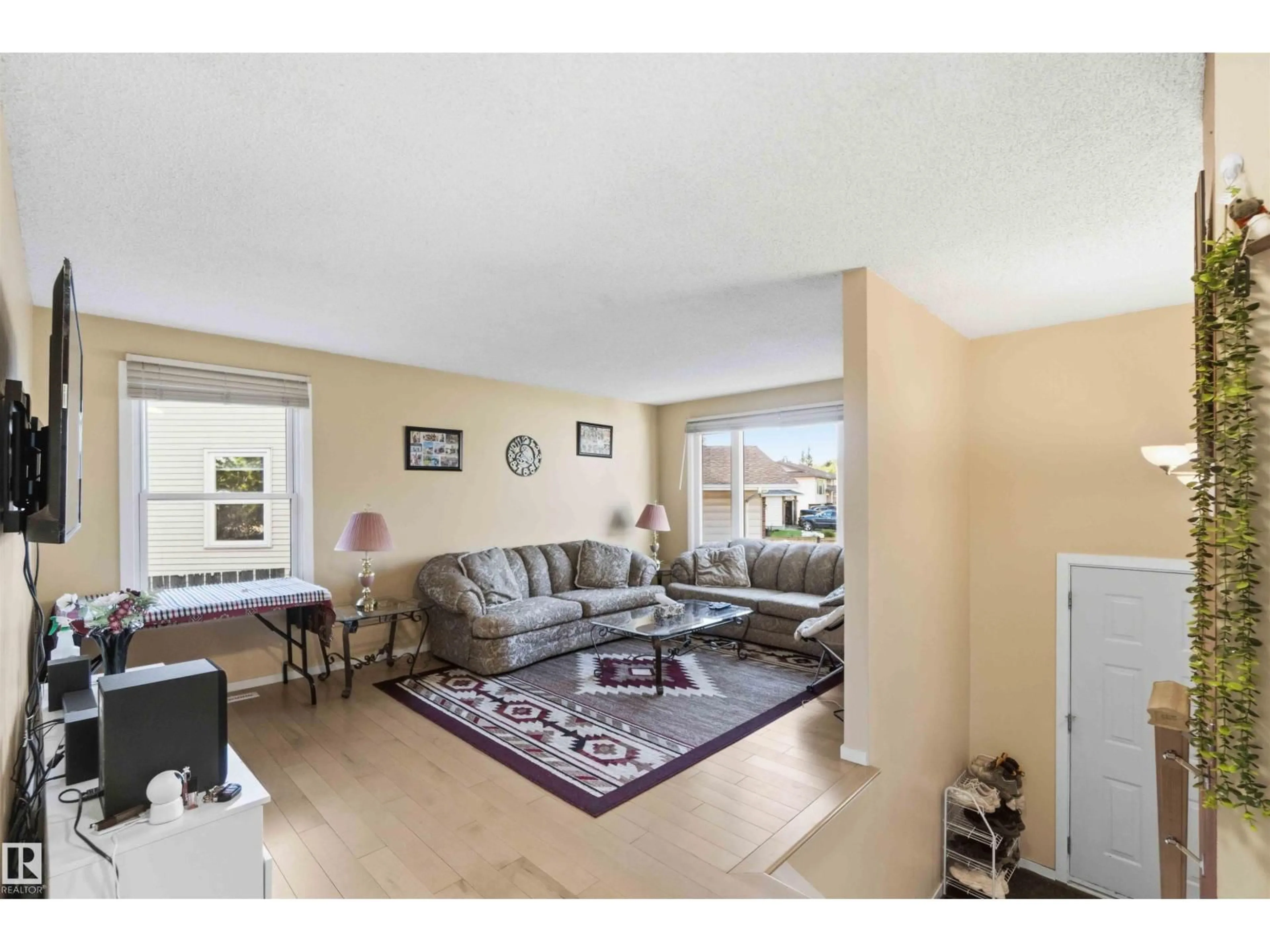 Living room with furniture, unknown for 8819 29 AV, Edmonton Alberta T6K2X5