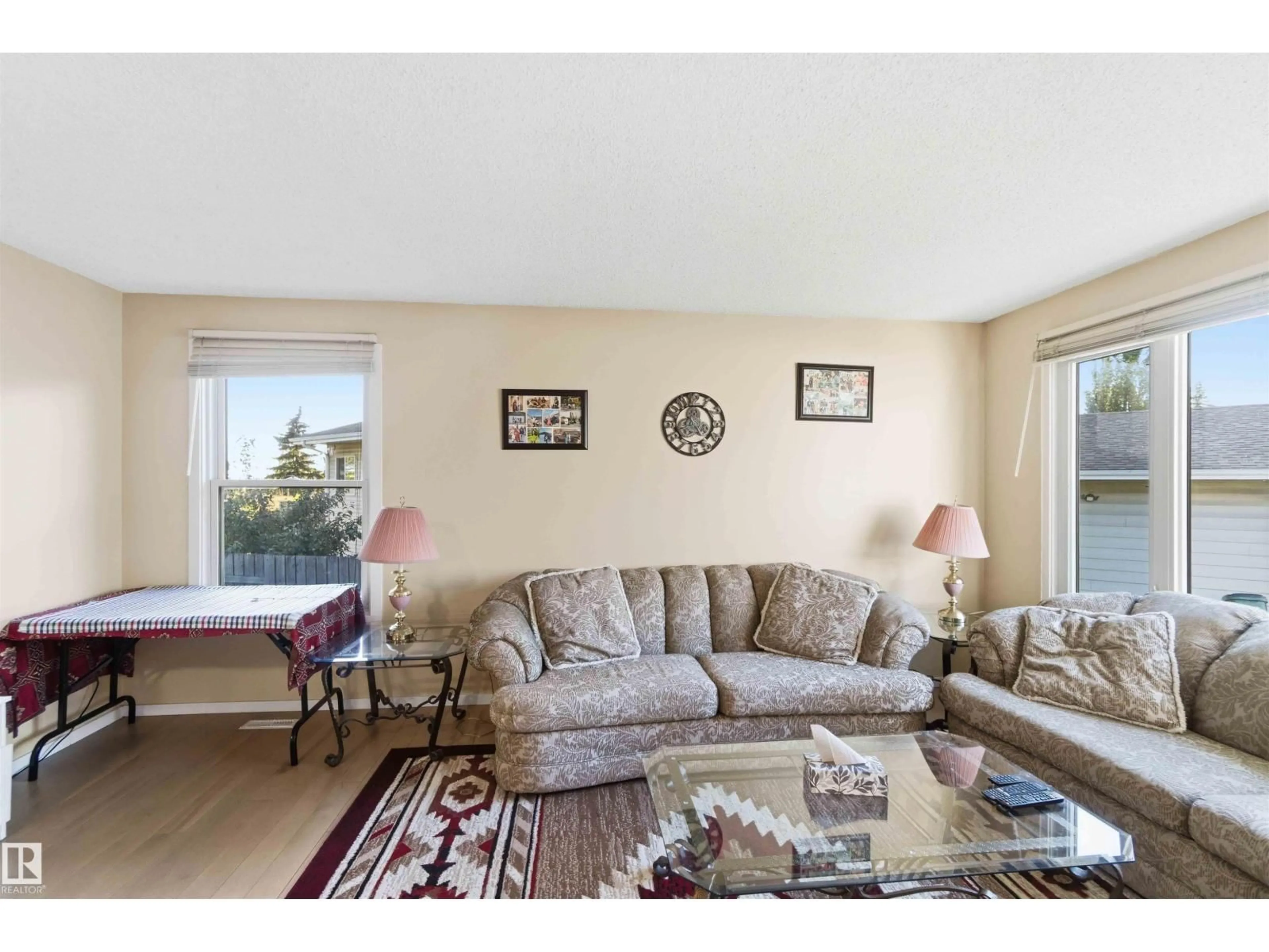 Living room with furniture, unknown for 8819 29 AV, Edmonton Alberta T6K2X5
