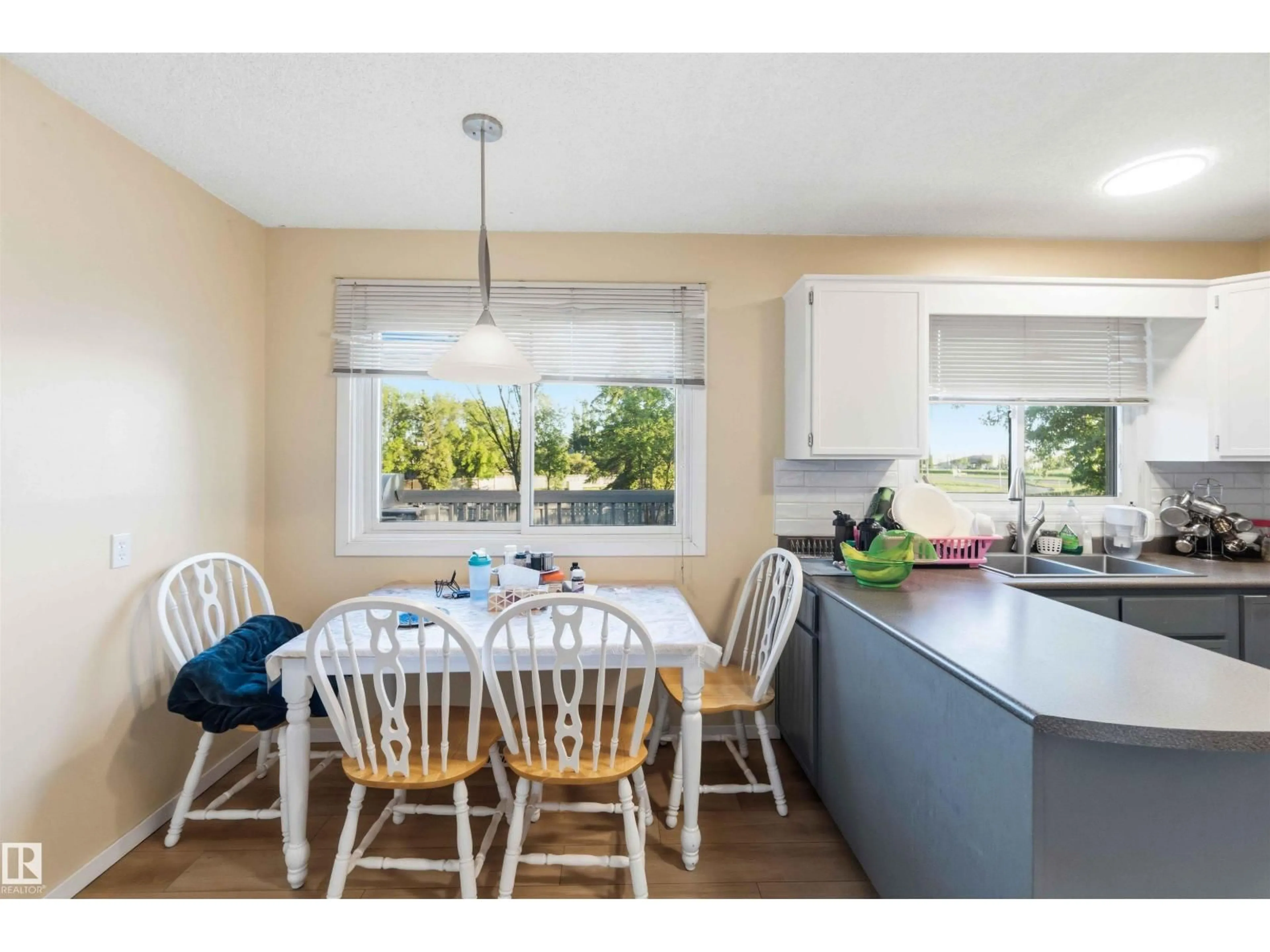 Open concept kitchen, wood/laminate floor for 8819 29 AV, Edmonton Alberta T6K2X5