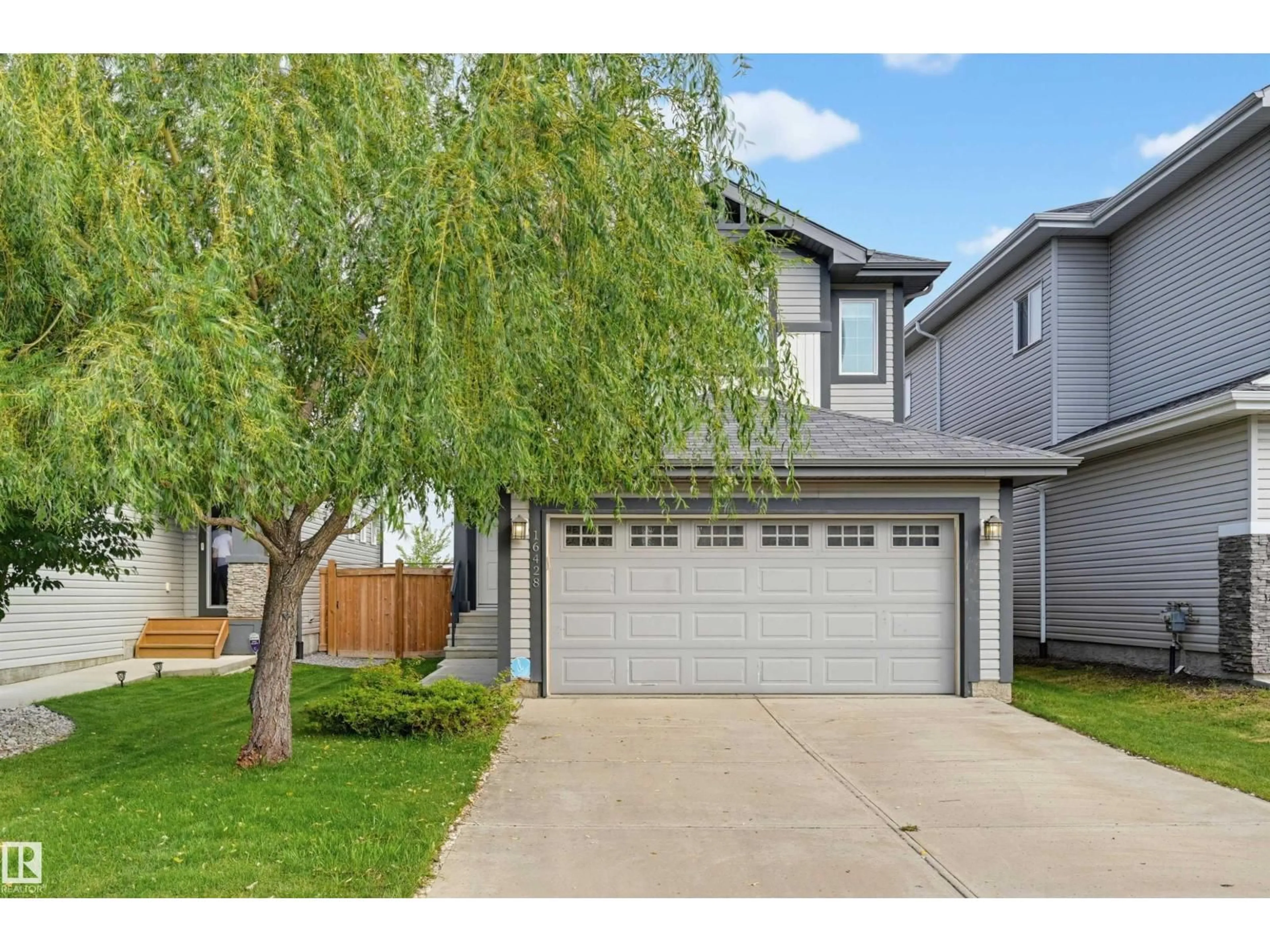 Home with vinyl exterior material, street for SW - 16428 12 AV, Edmonton Alberta T6W3K6