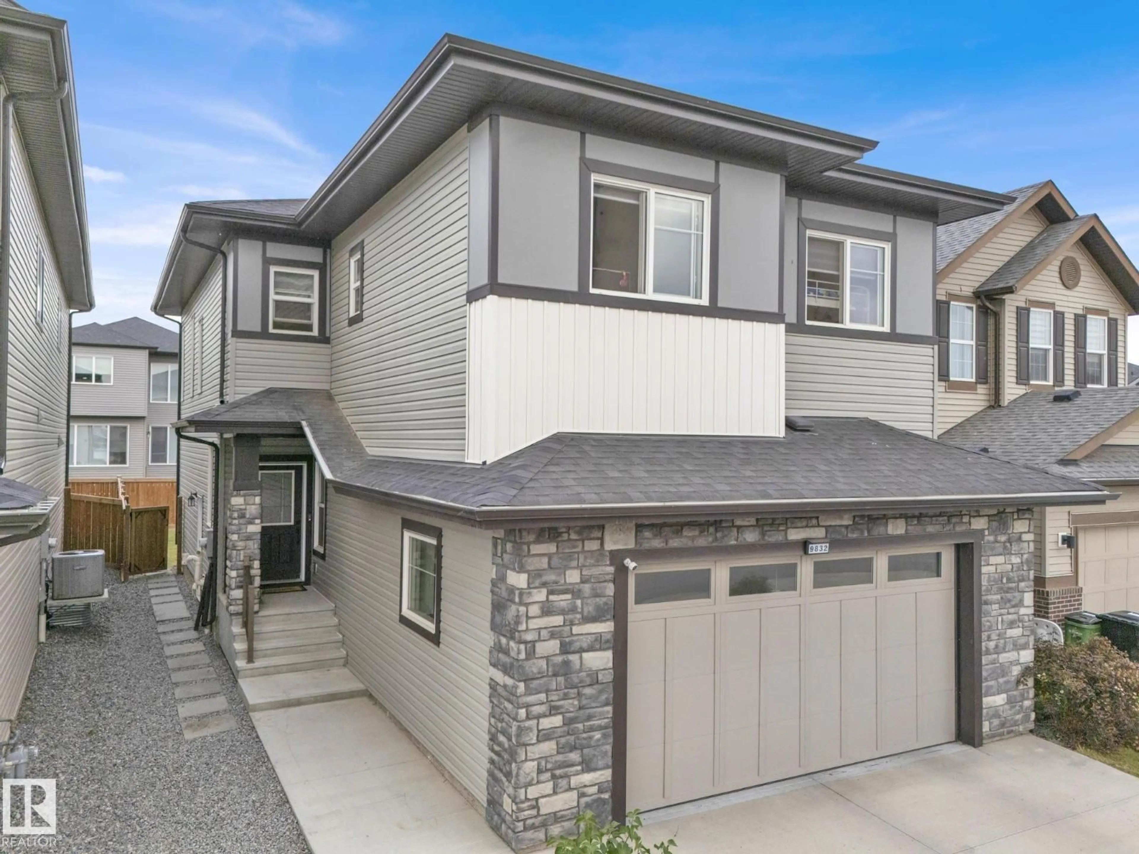Home with vinyl exterior material, street for 9832 225 ST, Edmonton Alberta T5T7C1