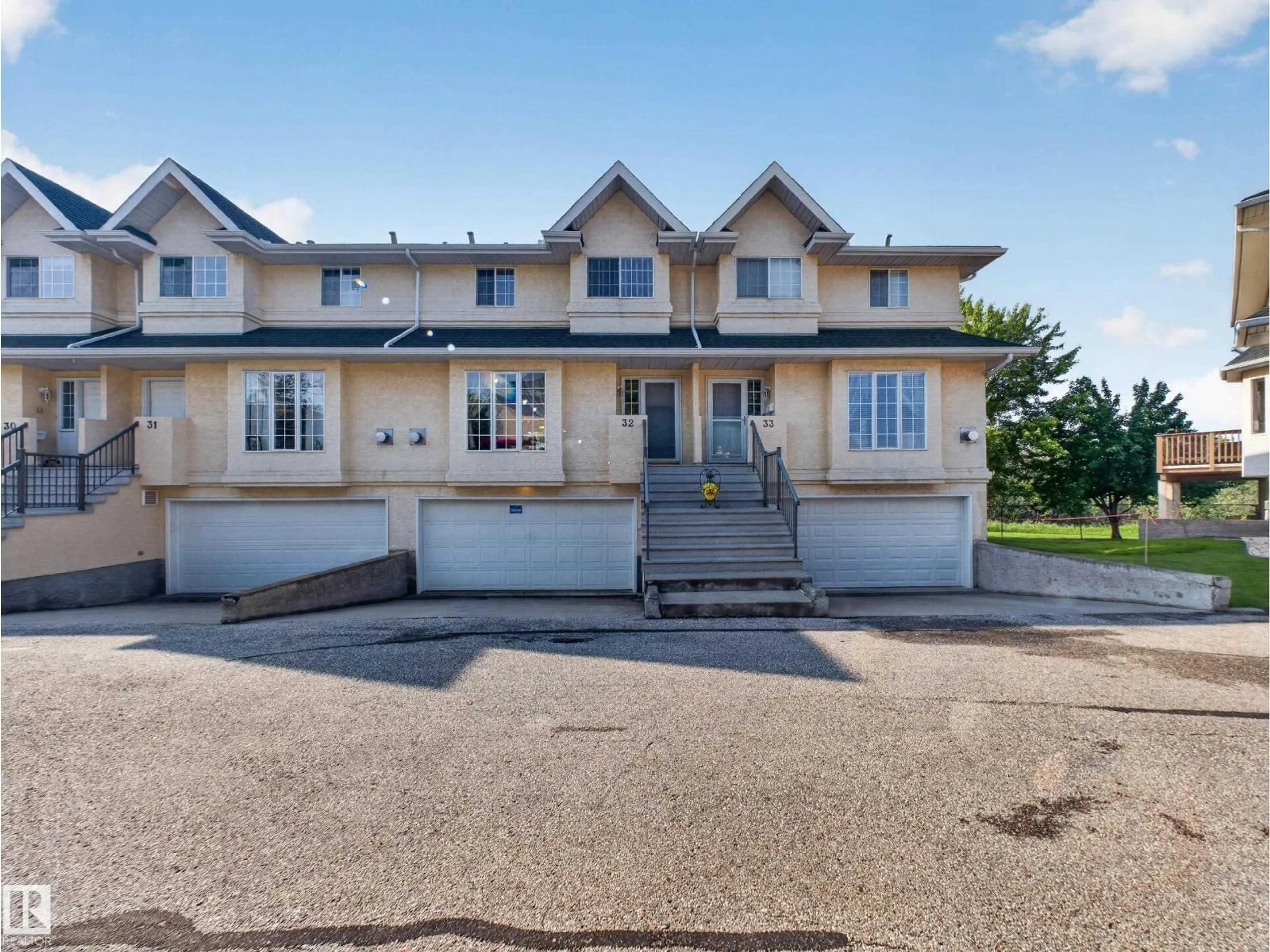 A pic from outside/outdoor area/front of a property/back of a property/a pic from drone, street for 32 - 2419 133 AV, Edmonton Alberta T5A5A5