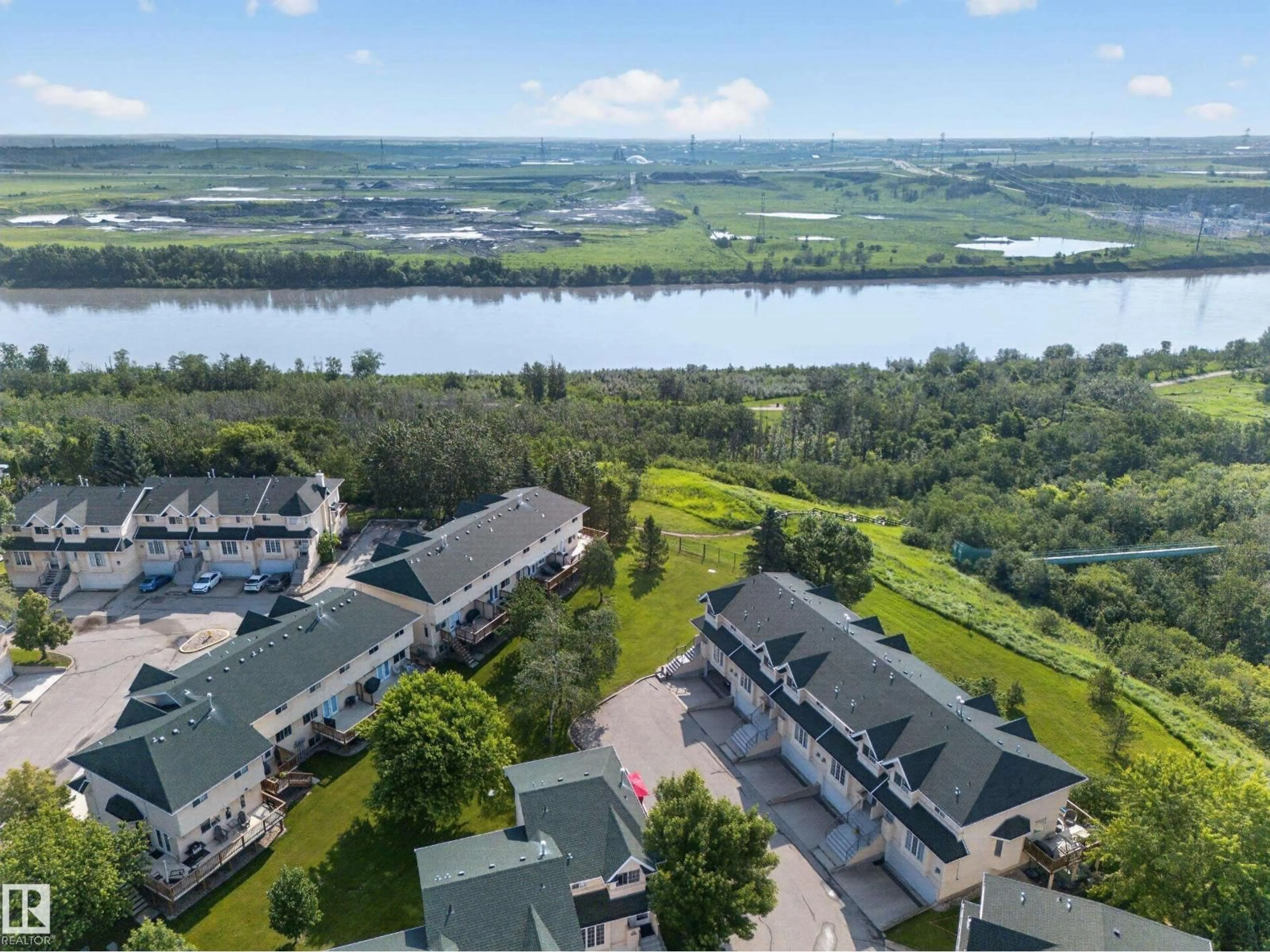 A pic from outside/outdoor area/front of a property/back of a property/a pic from drone, water/lake/river/ocean view for 32 - 2419 133 AV, Edmonton Alberta T5A5A5