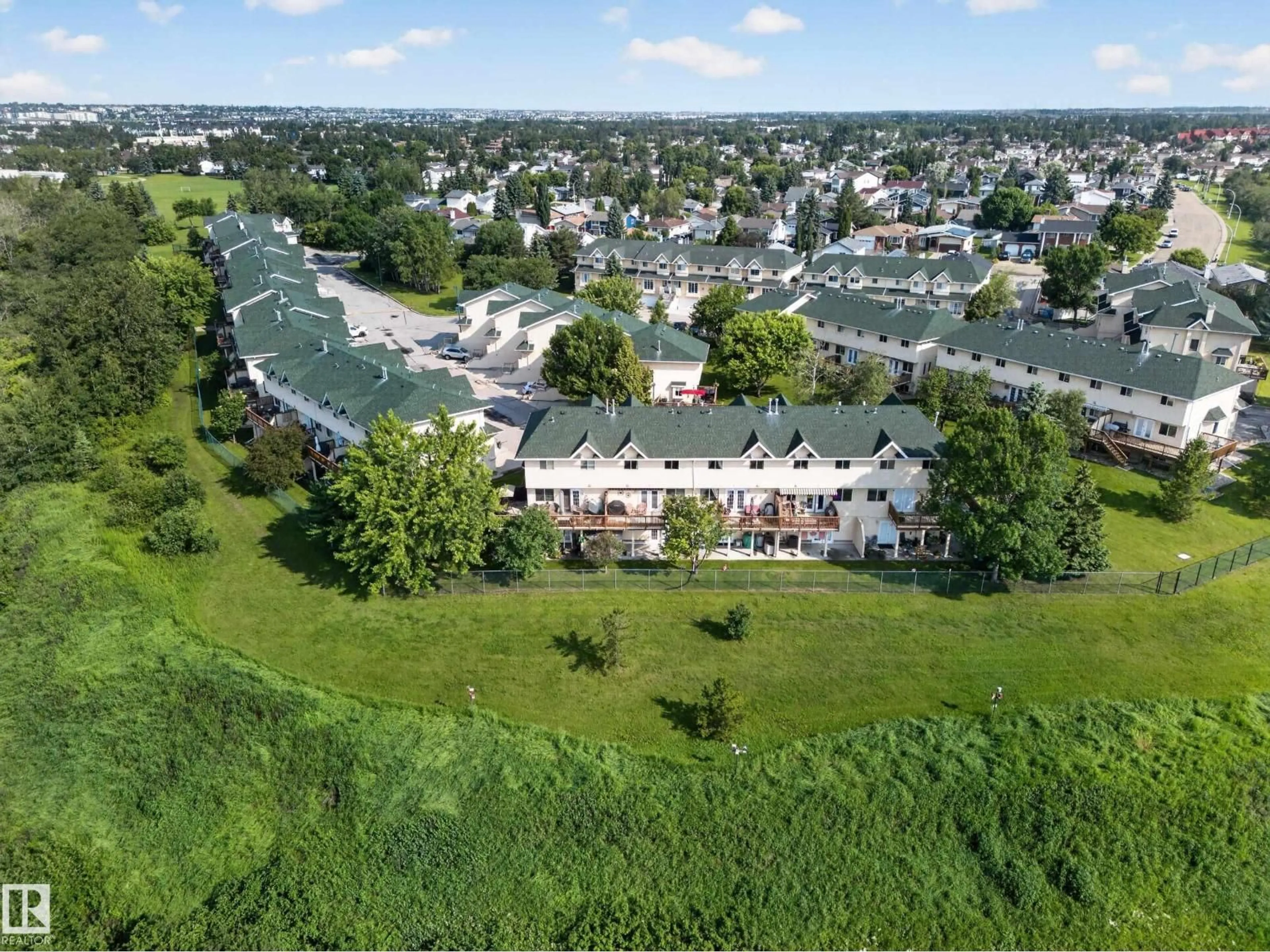 A pic from outside/outdoor area/front of a property/back of a property/a pic from drone, unknown for 32 - 2419 133 AV, Edmonton Alberta T5A5A5