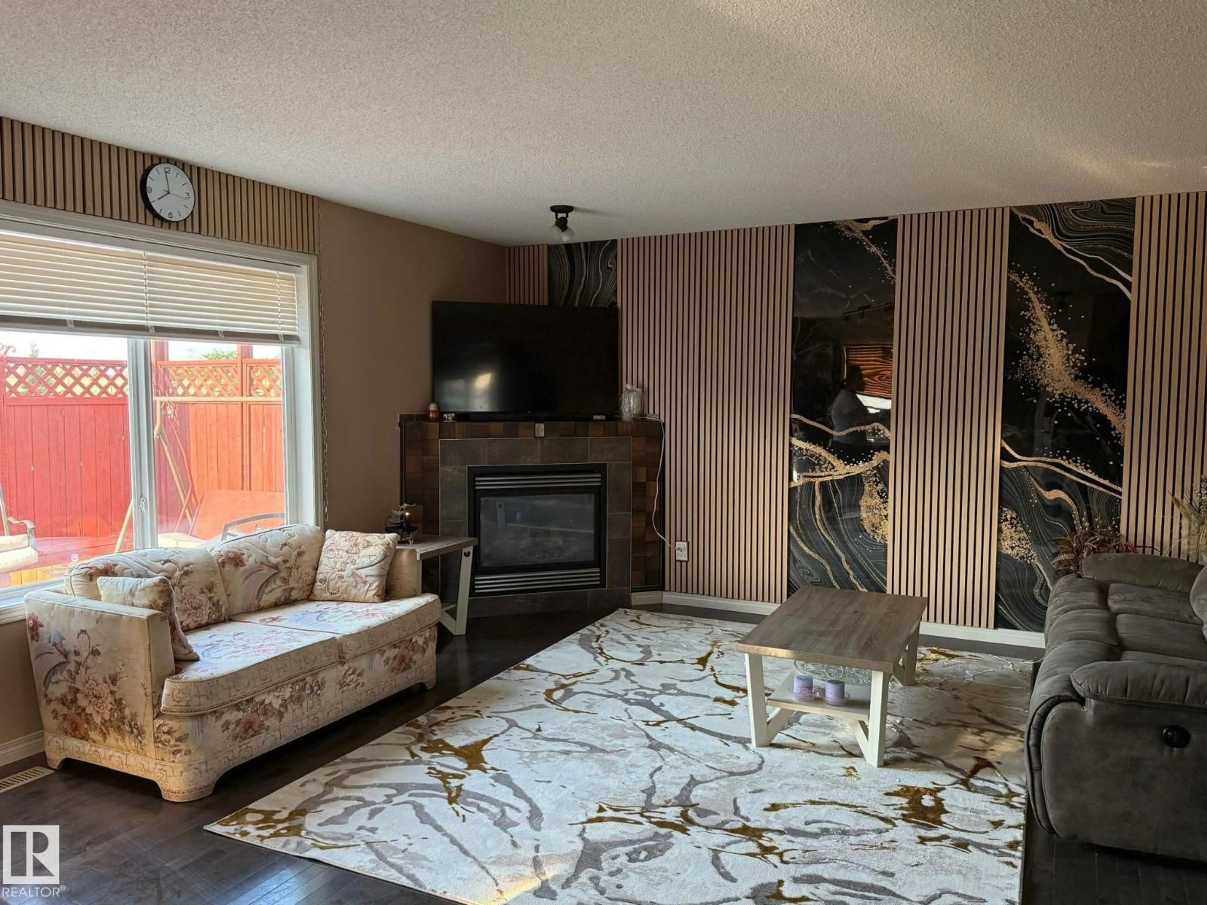 Living room with furniture, wood/laminate floor for NW - 1216 37C AV, Edmonton Alberta T6T0E5