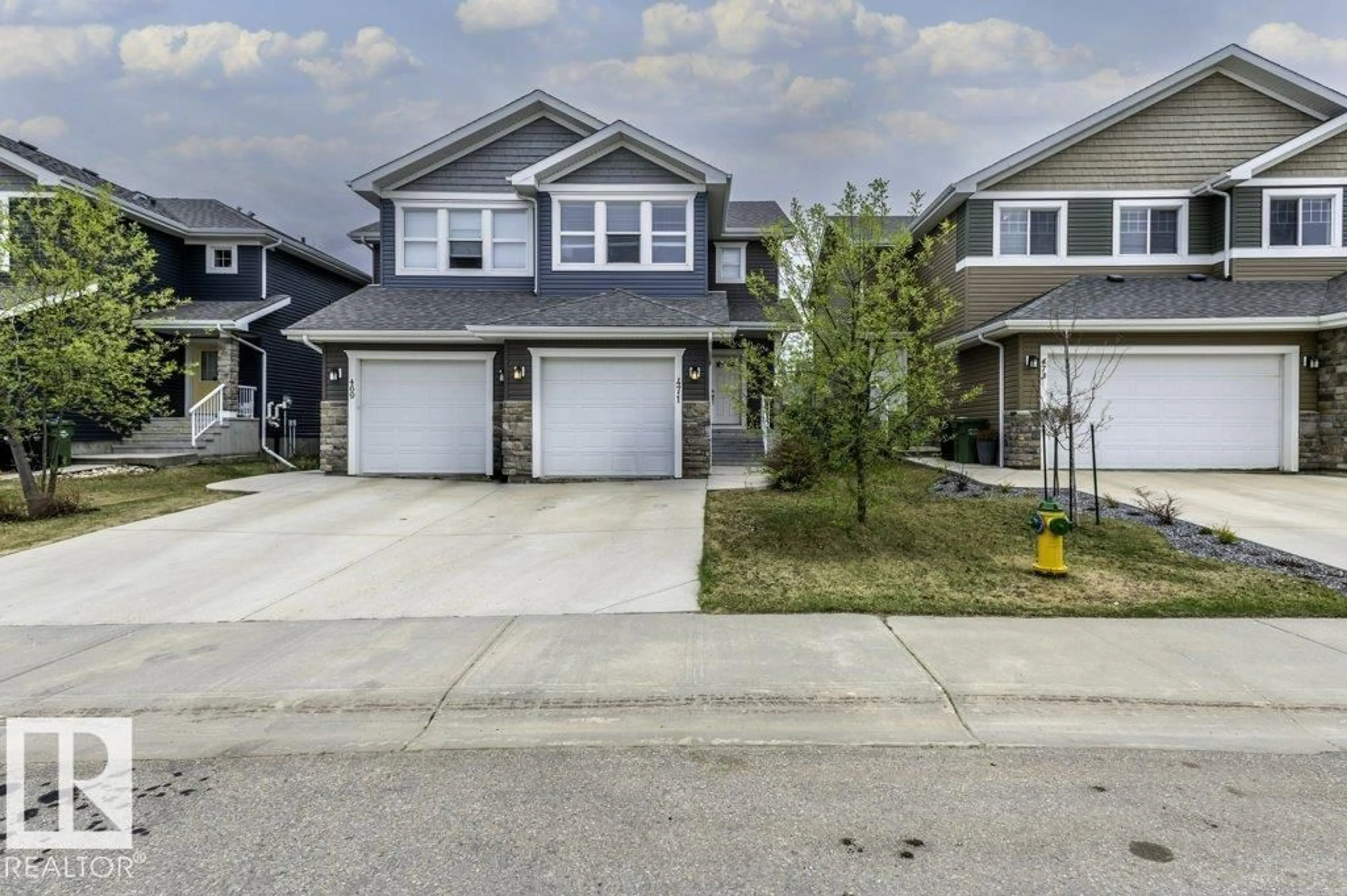 Home with vinyl exterior material, street for 471 REED CR, Leduc Alberta T9E0R5