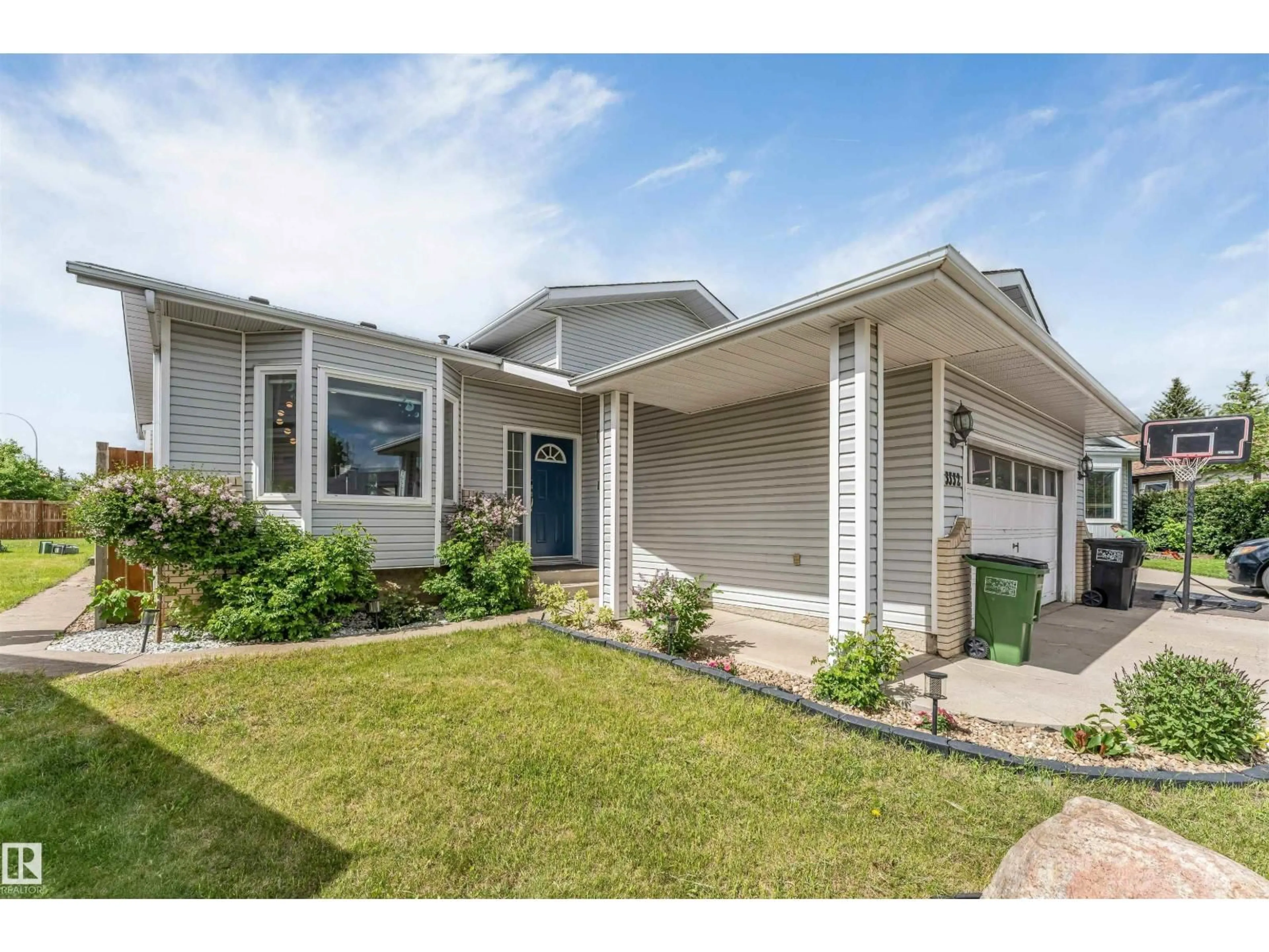 Home with vinyl exterior material, street for 3332 43 ST, Edmonton Alberta T6L6A4